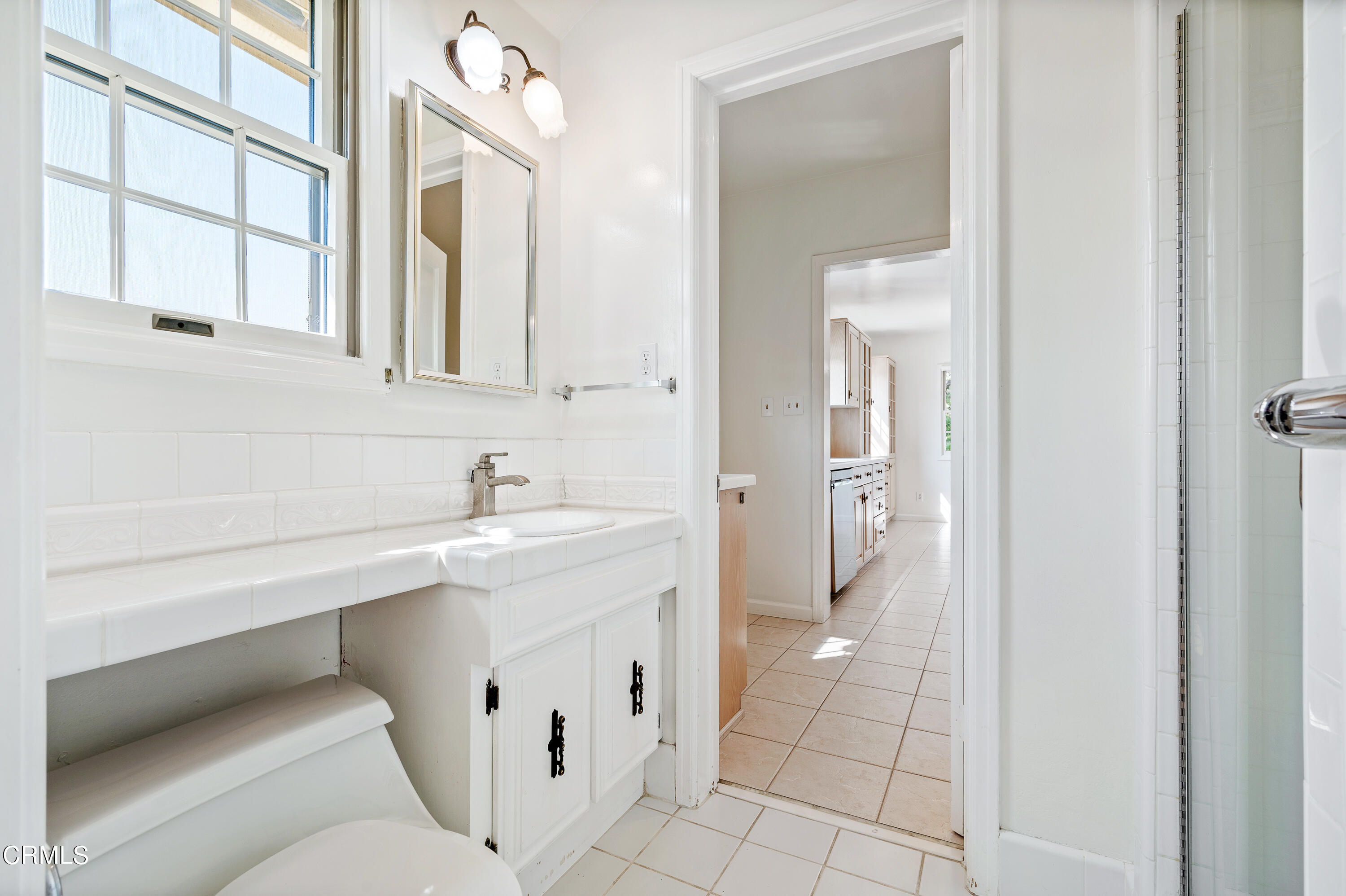 517 St Albans Road San Gabriel, CA 91775 - Photo 21 of 24 a bathroom with a toilet sink and mirror