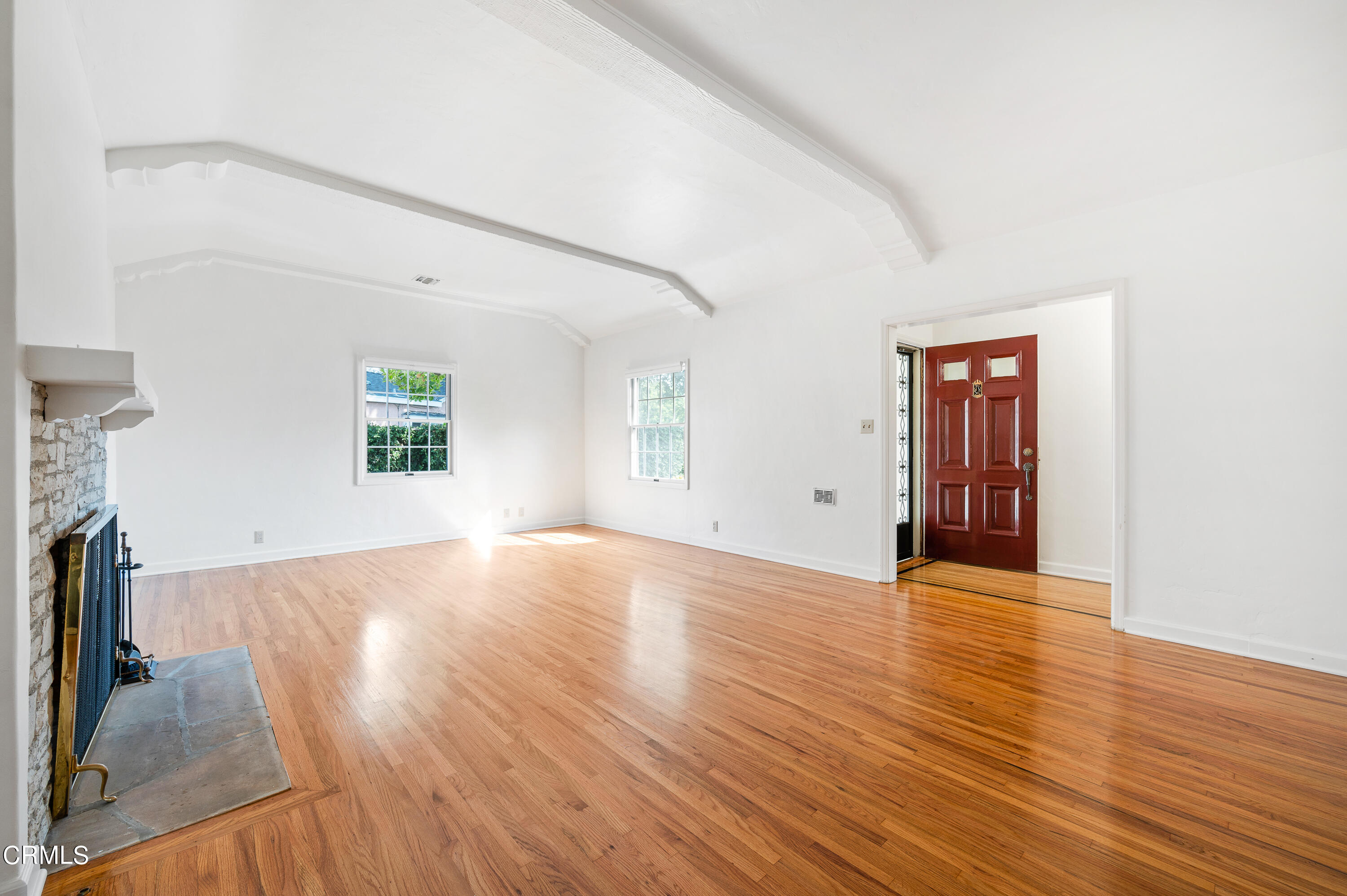 517 St Albans Road San Gabriel, CA 91775 - Photo 4 of 24 an empty room with wooden floor and windows