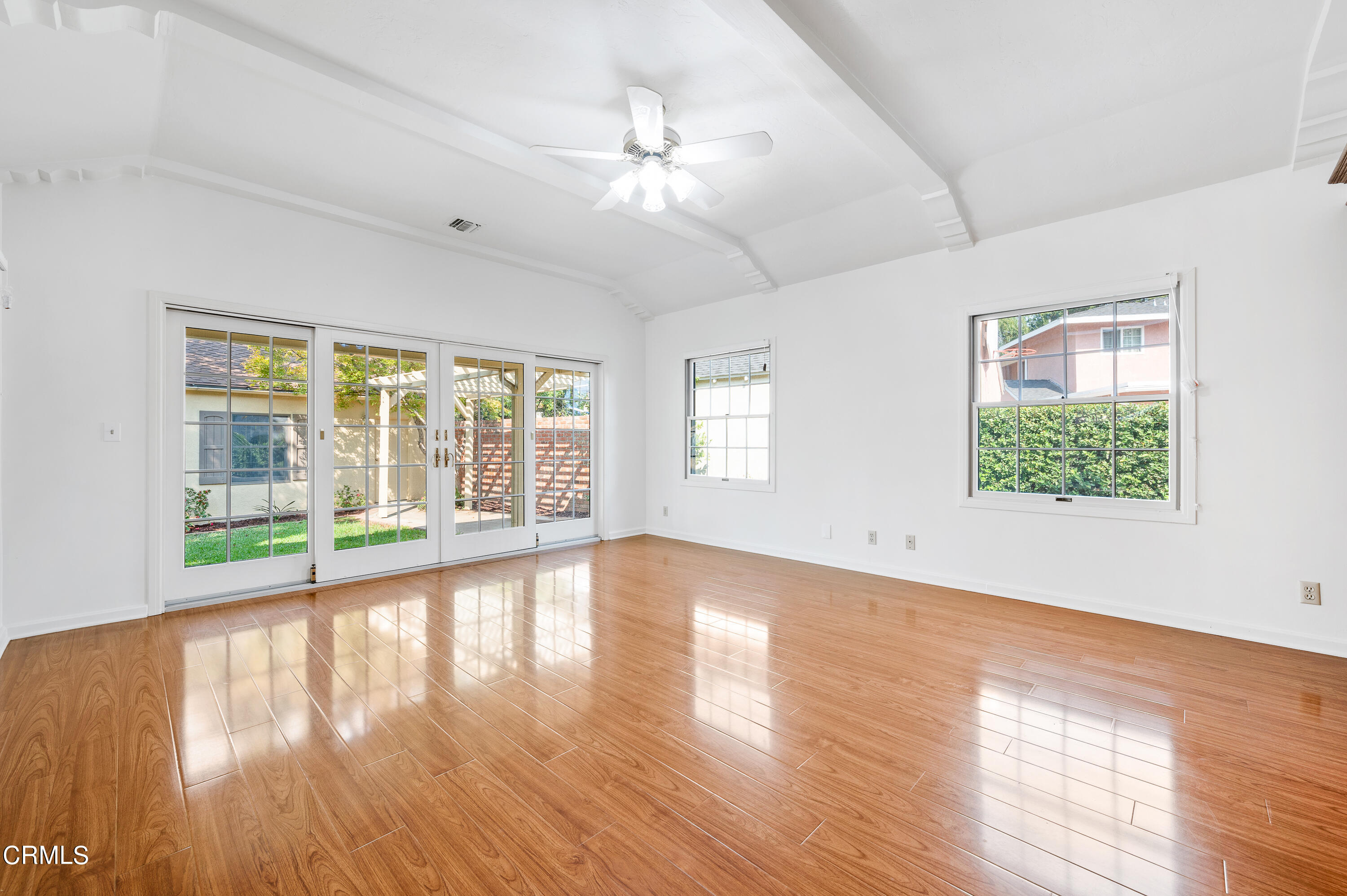 517 St Albans Road San Gabriel, CA 91775 - Photo 5 of 24 a view of an empty room with wooden floor and a window
