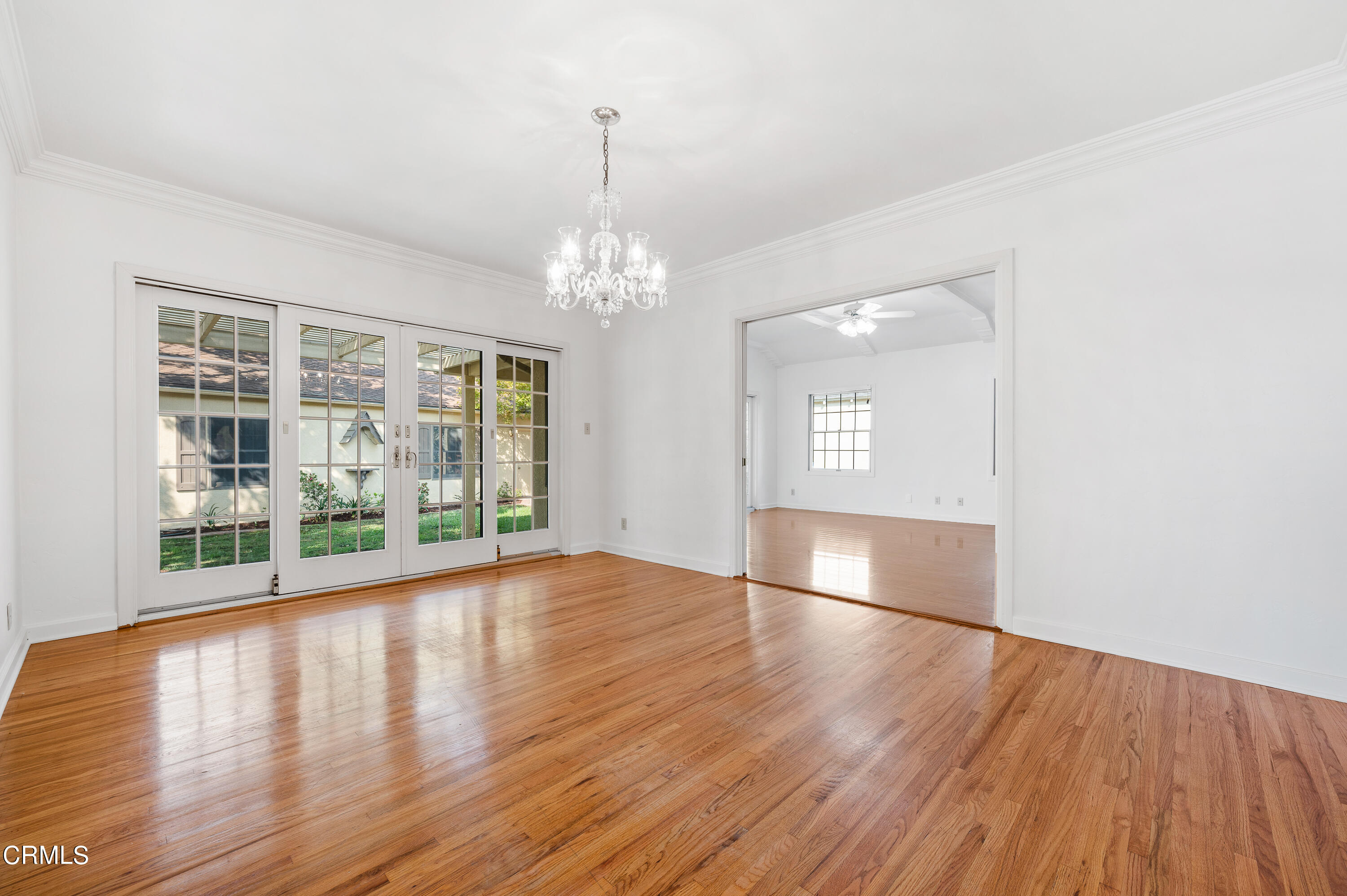 517 St Albans Road San Gabriel, CA 91775 - Photo 6 of 24 a view of an empty room with wooden floor and a window