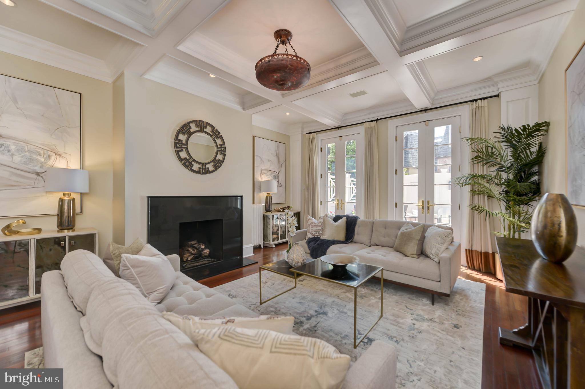 2130 Leroy Place Northwest Washington, DC 20008 - Photo 13 of 98 a living room with furniture a clock and a fireplace