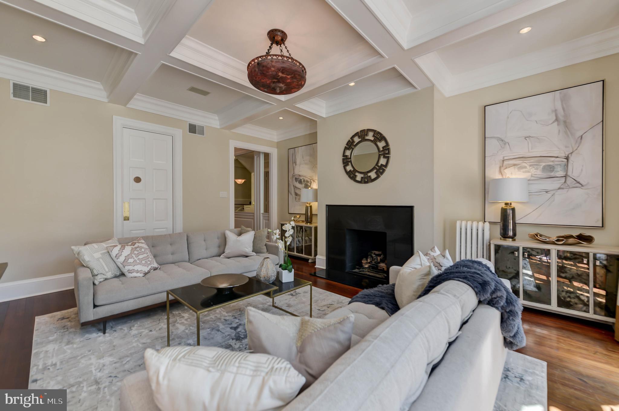 2130 Leroy Place Northwest Washington, DC 20008 - Photo 15 of 98 a living room with furniture a clock and a fireplace
