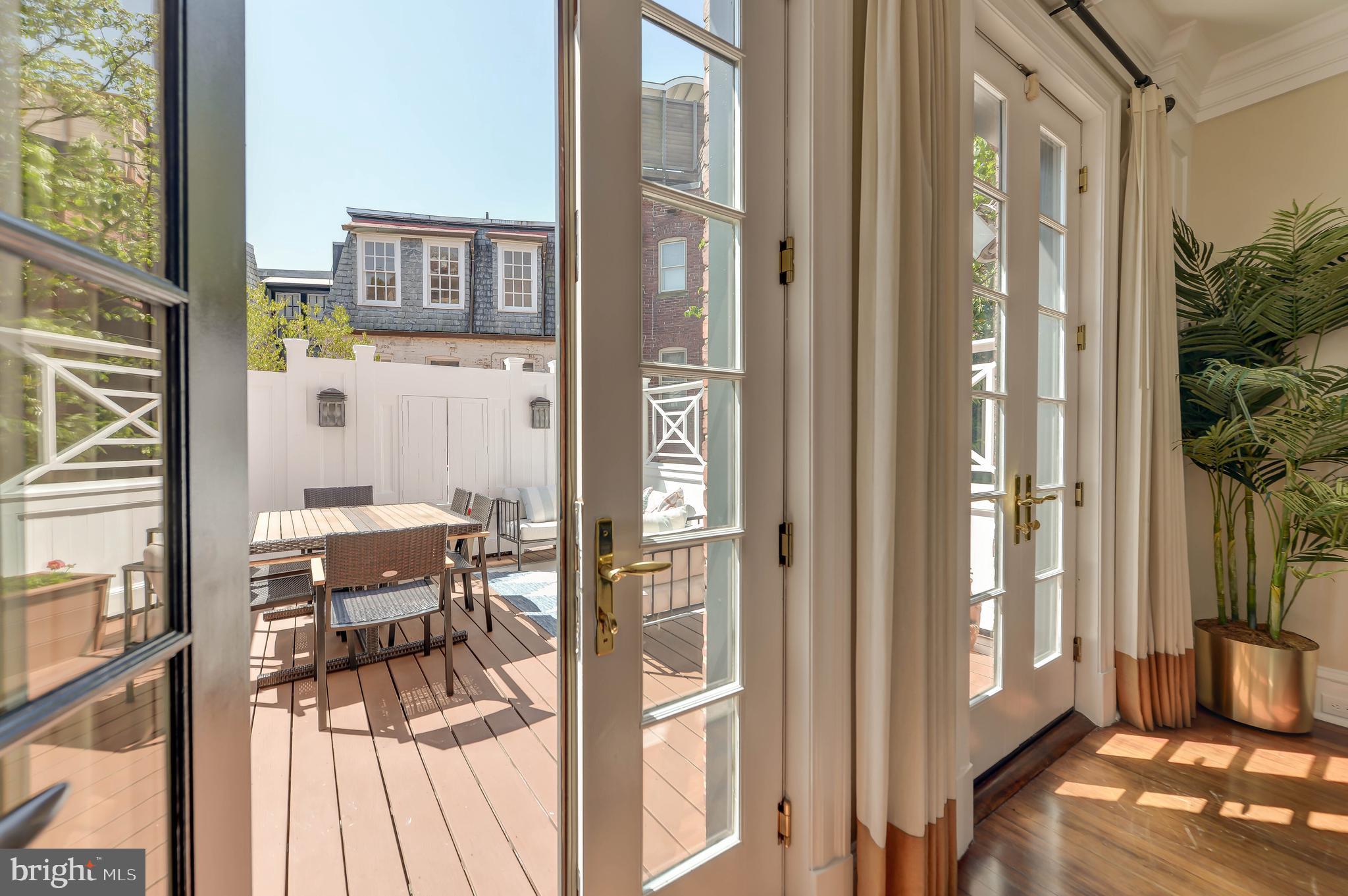 2130 Leroy Place Northwest Washington, DC 20008 - Photo 18 of 98 a view of a balcony with furniture and floor to ceiling window