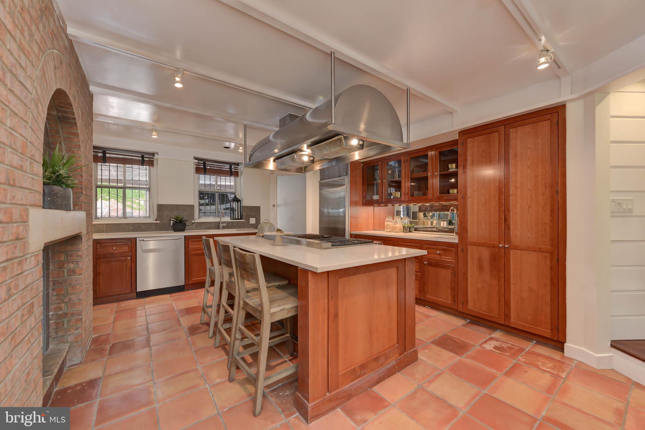 2130 Leroy Place Northwest Washington, DC 20008 - Photo 25 of 98 a kitchen with stainless steel appliances granite countertop a stove and a refrigerator