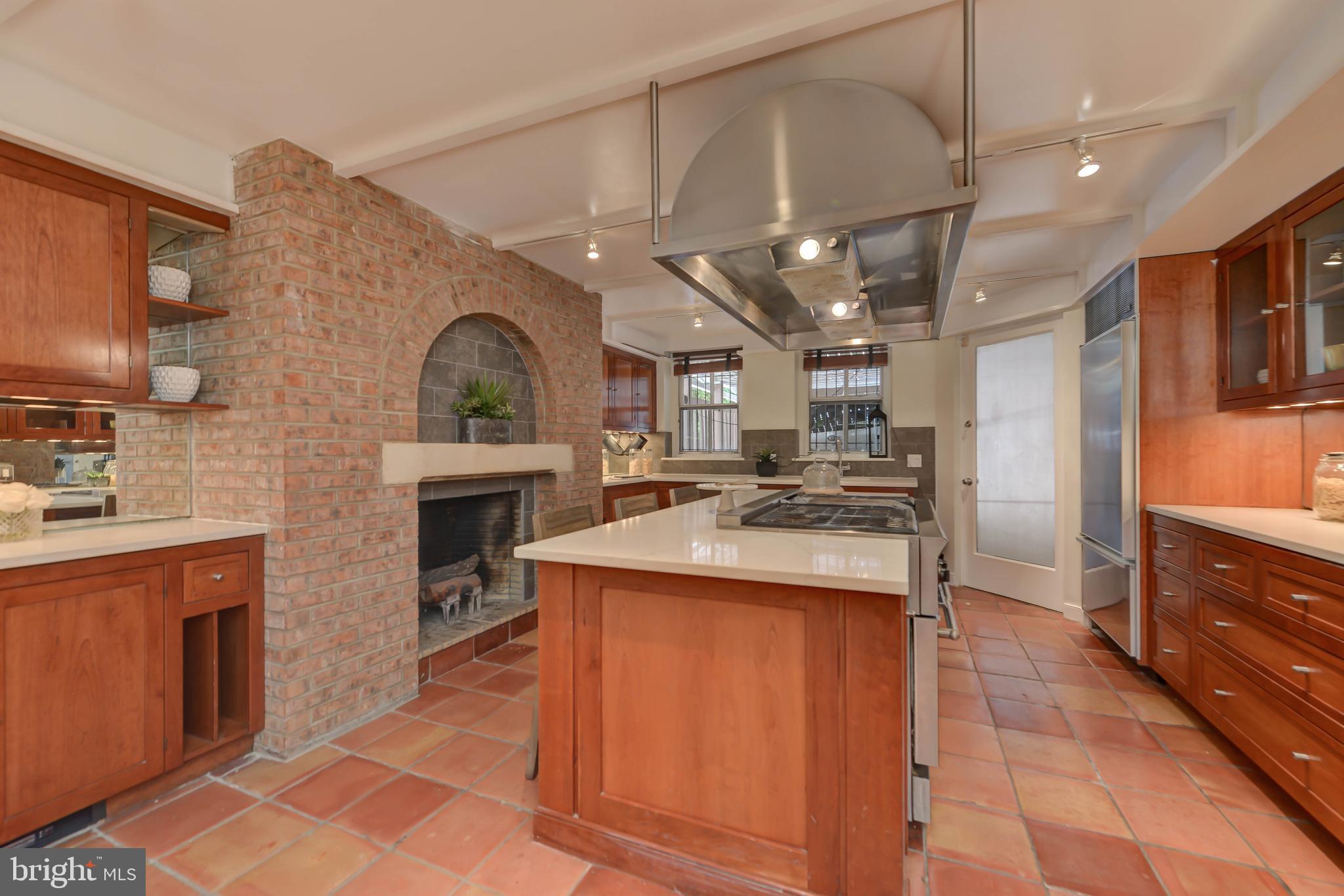 2130 Leroy Place Northwest Washington, DC 20008 - Photo 26 of 98 a kitchen with kitchen island granite countertop a stove and a sink