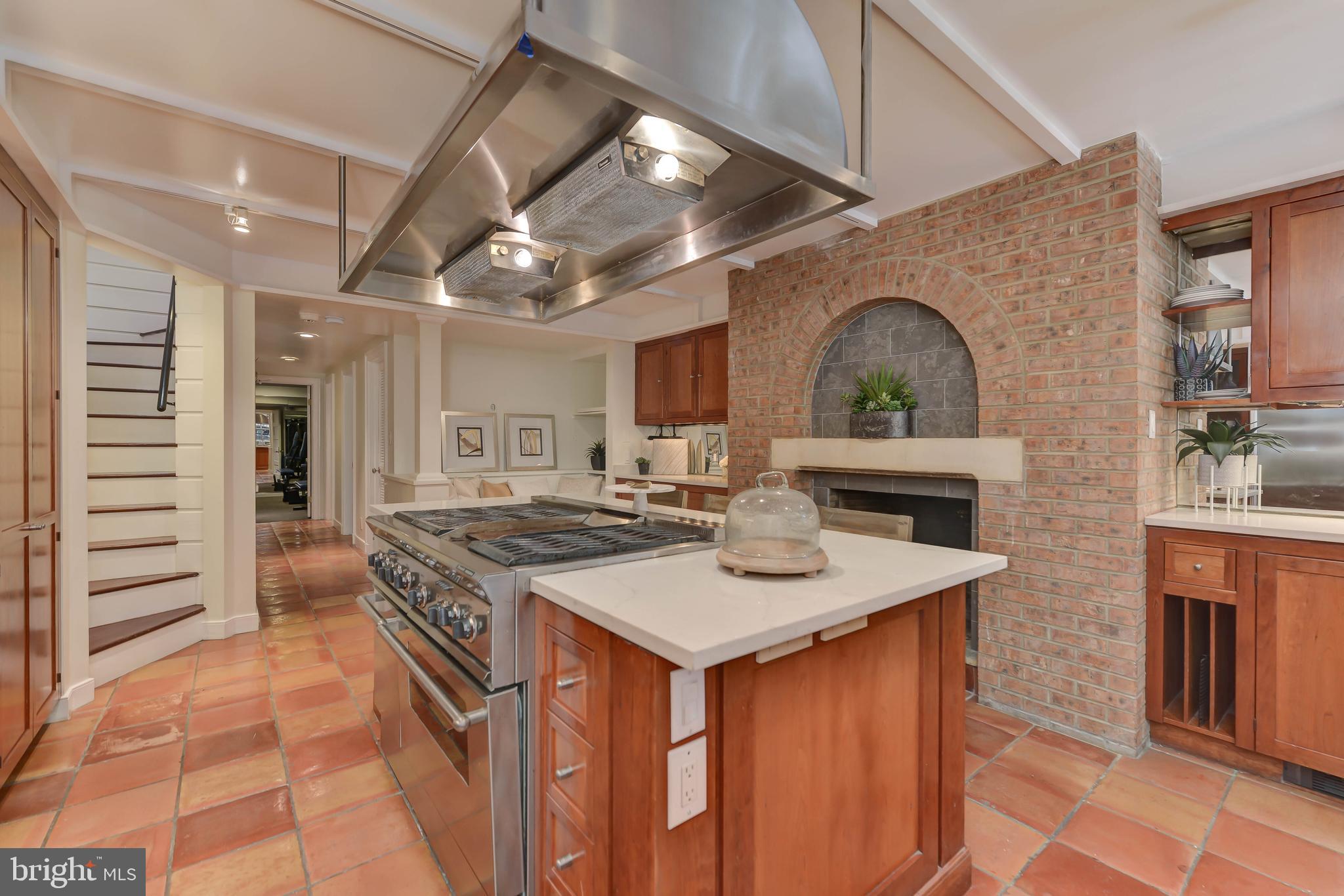 2130 Leroy Place Northwest Washington, DC 20008 - Photo 32 of 98 a kitchen with stainless steel appliances granite countertop a stove a sink dishwasher and a refrigerator with wooden floor