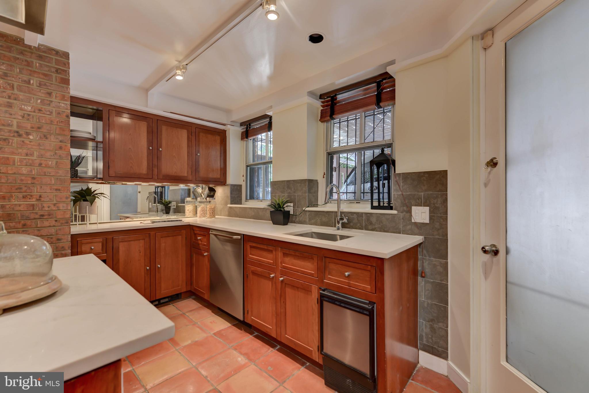 2130 Leroy Place Northwest Washington, DC 20008 - Photo 37 of 98 a kitchen with a sink stove and cabinets