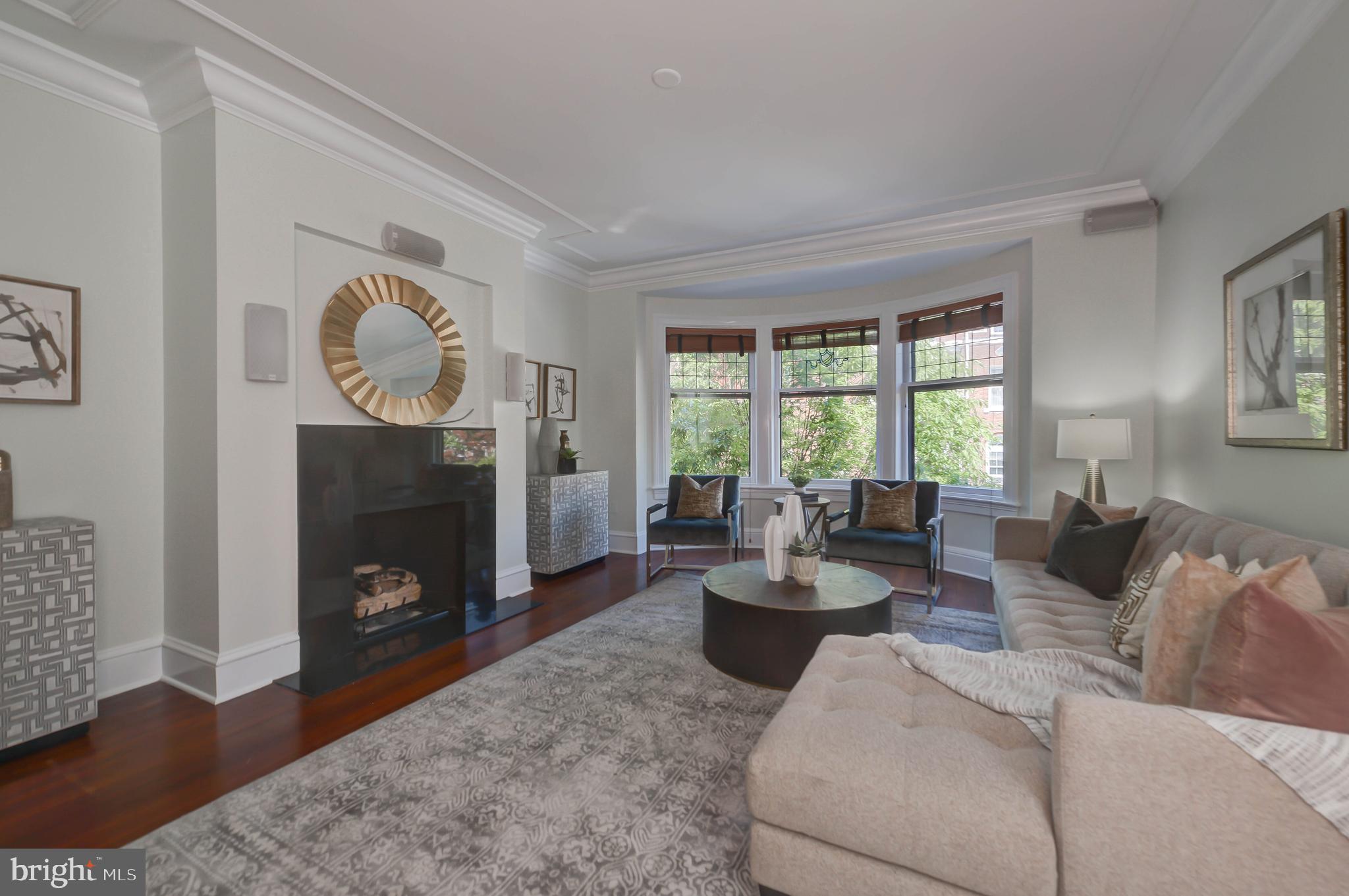 2130 Leroy Place Northwest Washington, DC 20008 - Photo 42 of 98 a living room with furniture a fireplace and a large window