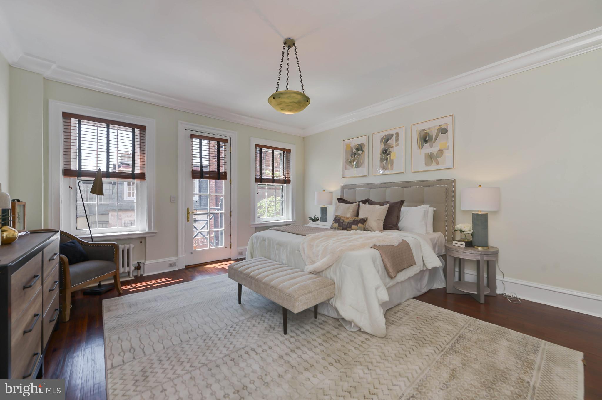 2130 Leroy Place Northwest Washington, DC 20008 - Photo 46 of 98 a spacious bedroom with a bed and a window