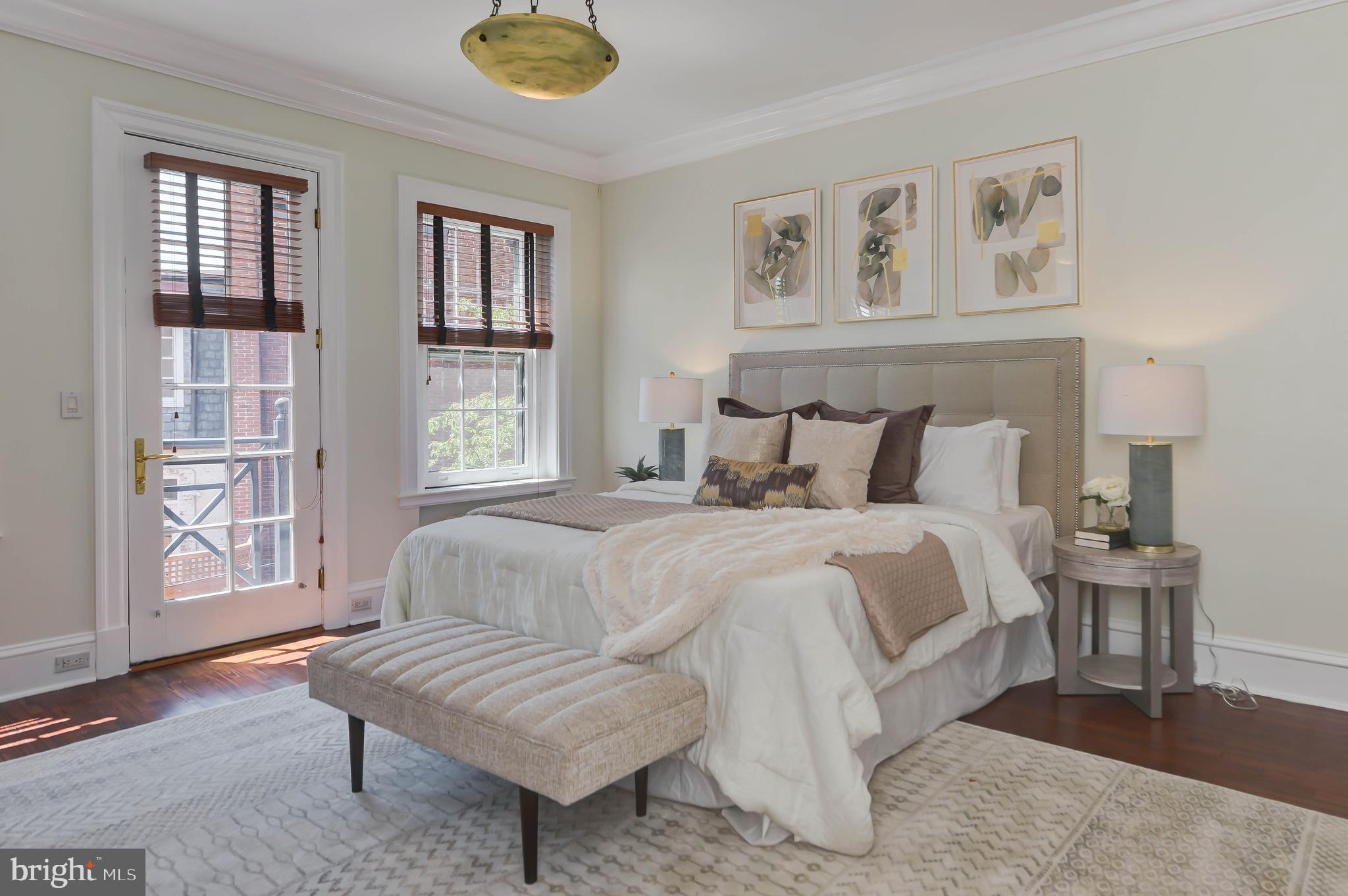 2130 Leroy Place Northwest Washington, DC 20008 - Photo 47 of 98 a bedroom with a large bed and a couch