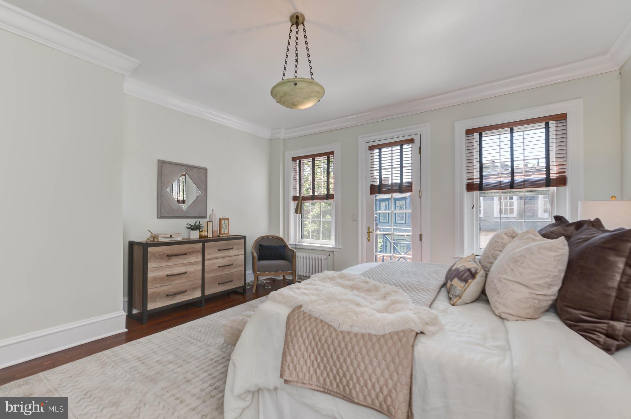 2130 Leroy Place Northwest Washington, DC 20008 - Photo 50 of 98 a bedroom with a large bed and a dresser
