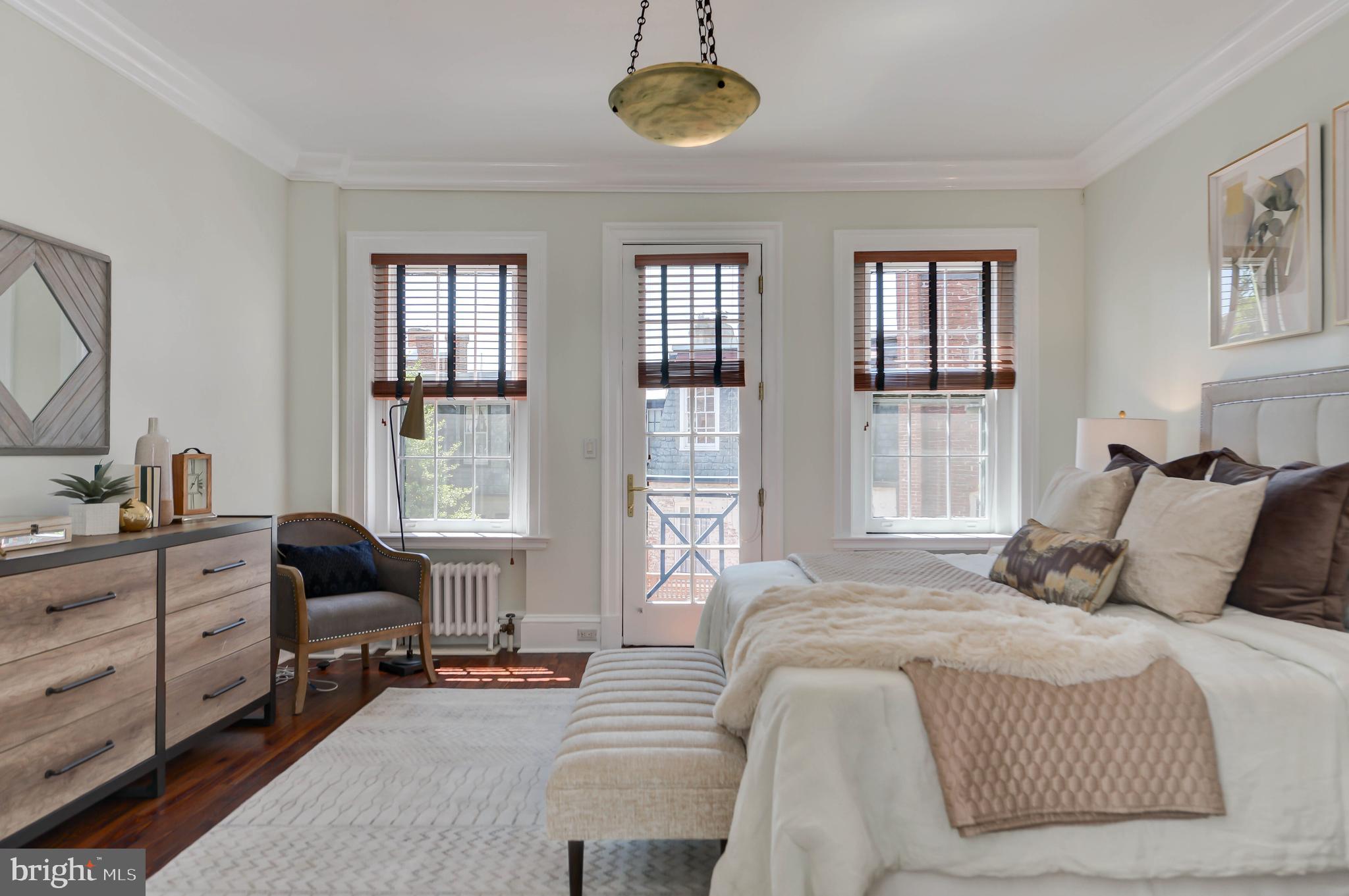 2130 Leroy Place Northwest Washington, DC 20008 - Photo 51 of 98 a bedroom with a bed and a window