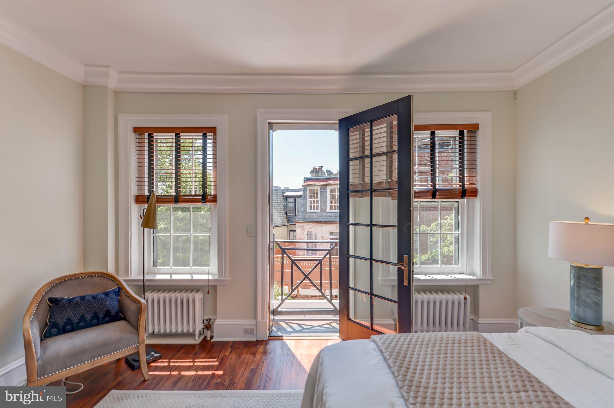 2130 Leroy Place Northwest Washington, DC 20008 - Photo 52 of 98 a bedroom with a bed and wooden floor