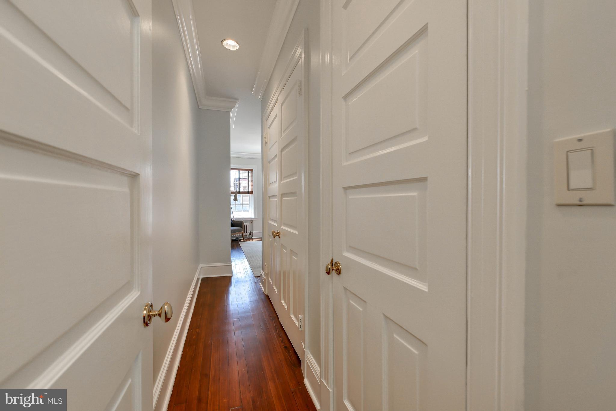 2130 Leroy Place Northwest Washington, DC 20008 - Photo 57 of 98 a view of a hallway with wooden floor and staircase