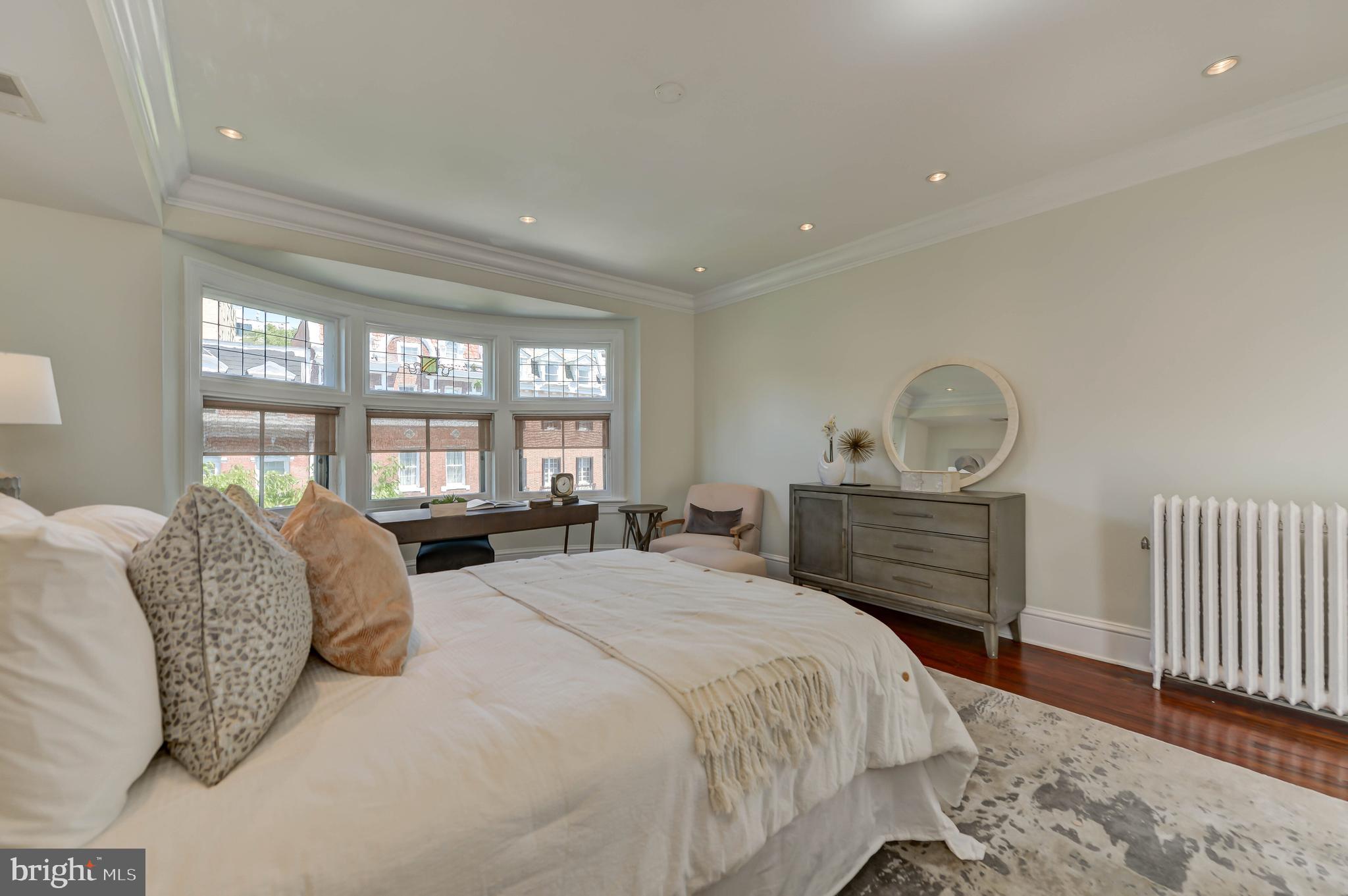 2130 Leroy Place Northwest Washington, DC 20008 - Photo 61 of 98 a bedroom with a large bed and a window