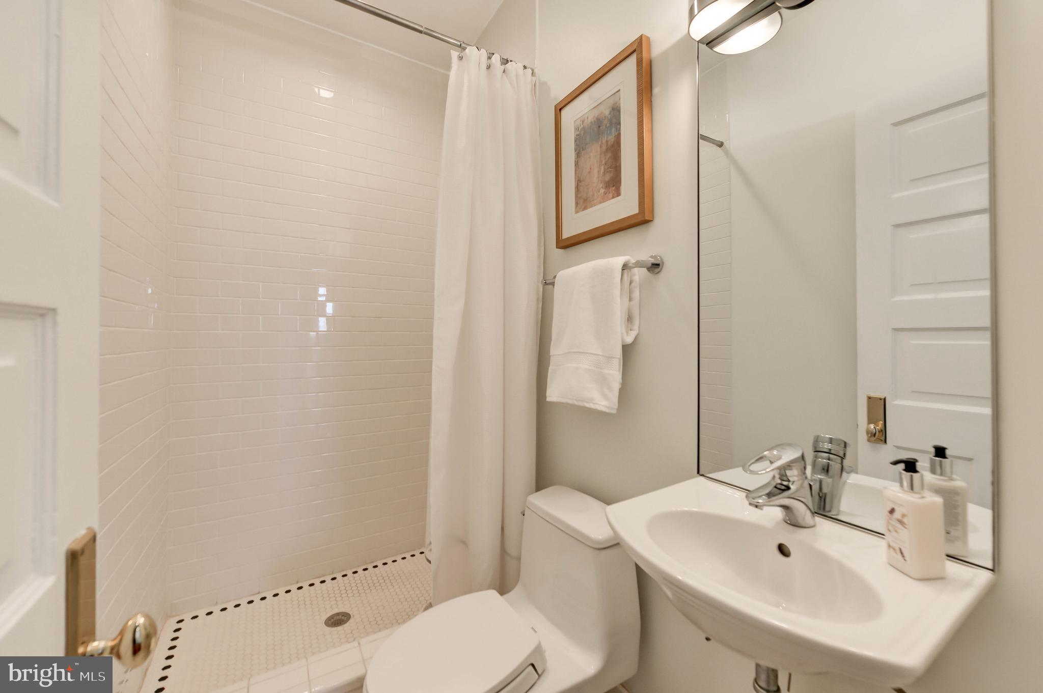 2130 Leroy Place Northwest Washington, DC 20008 - Photo 64 of 98 a bathroom with a sink toilet and shower