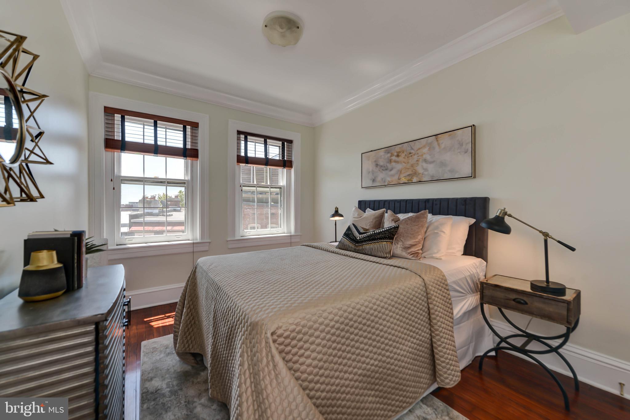 2130 Leroy Place Northwest Washington, DC 20008 - Photo 66 of 98 a bed room with a bed and a chair