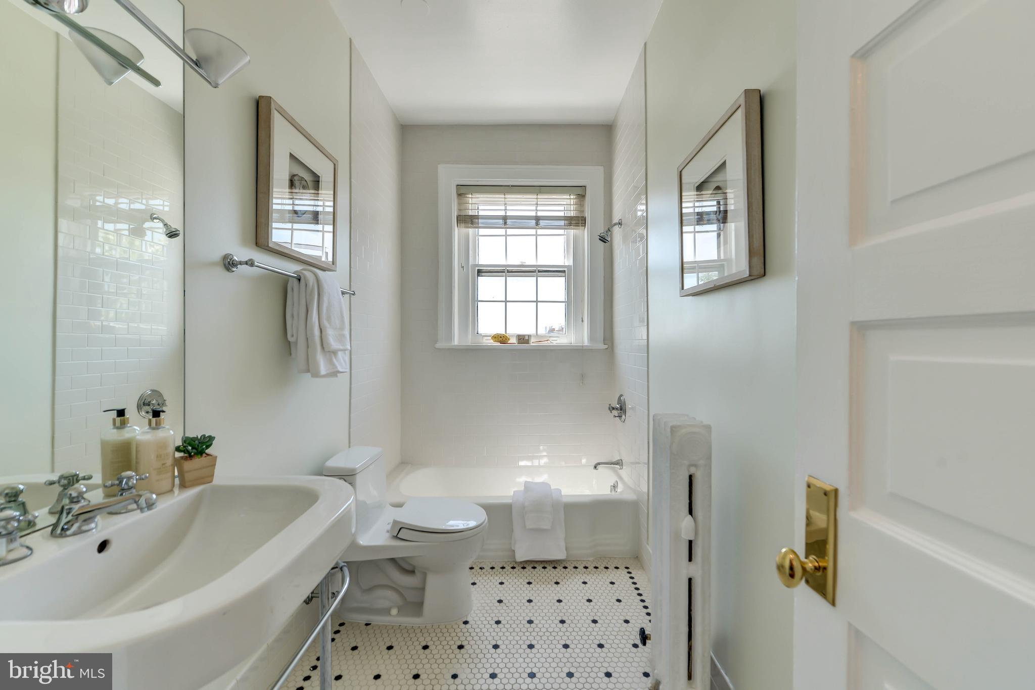 2130 Leroy Place Northwest Washington, DC 20008 - Photo 70 of 98 a bathroom with a sink a toilet and shower