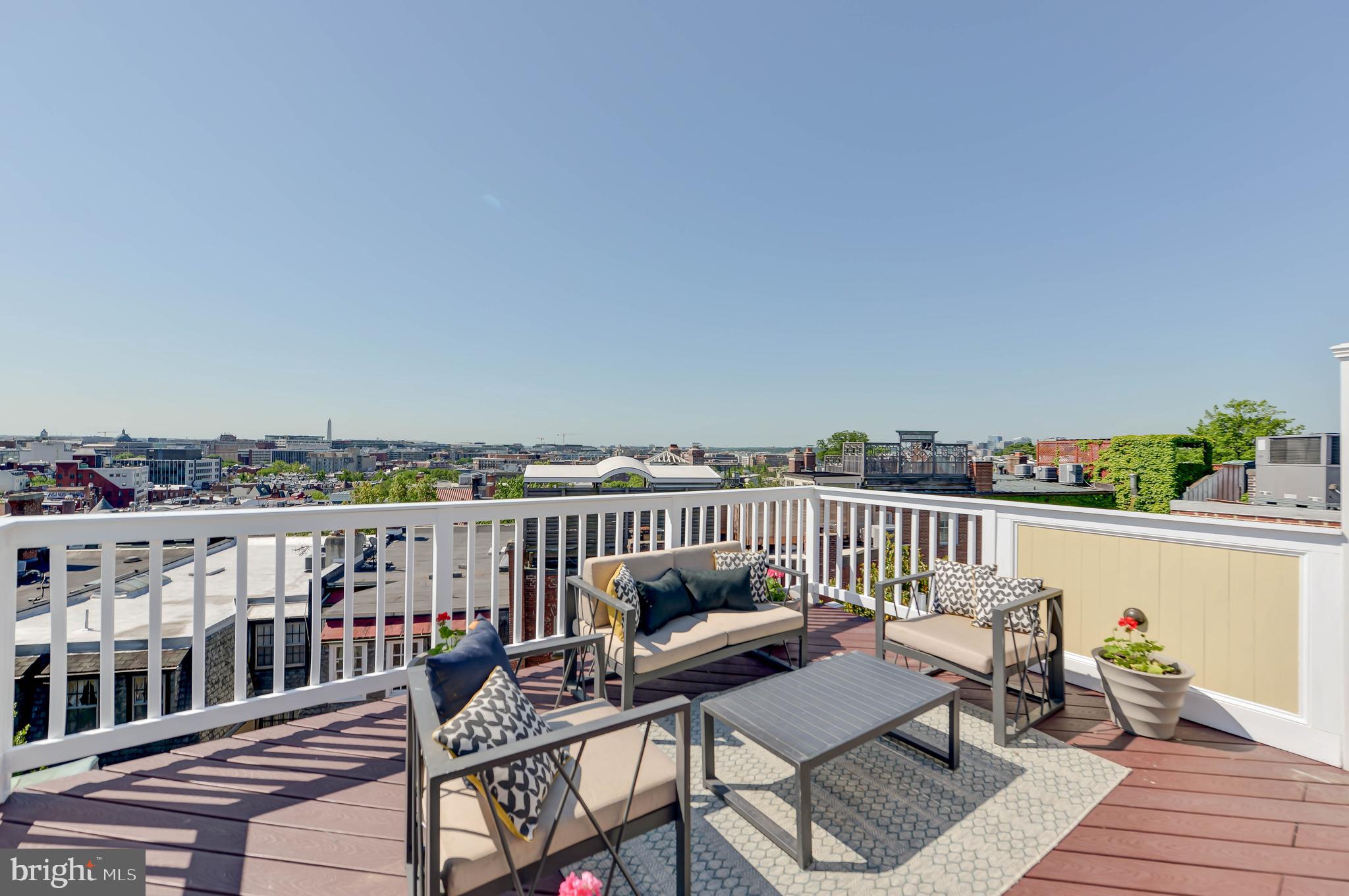 2130 Leroy Place Northwest Washington, DC 20008 - Photo 76 of 98 a view of a balcony with wooden chairs