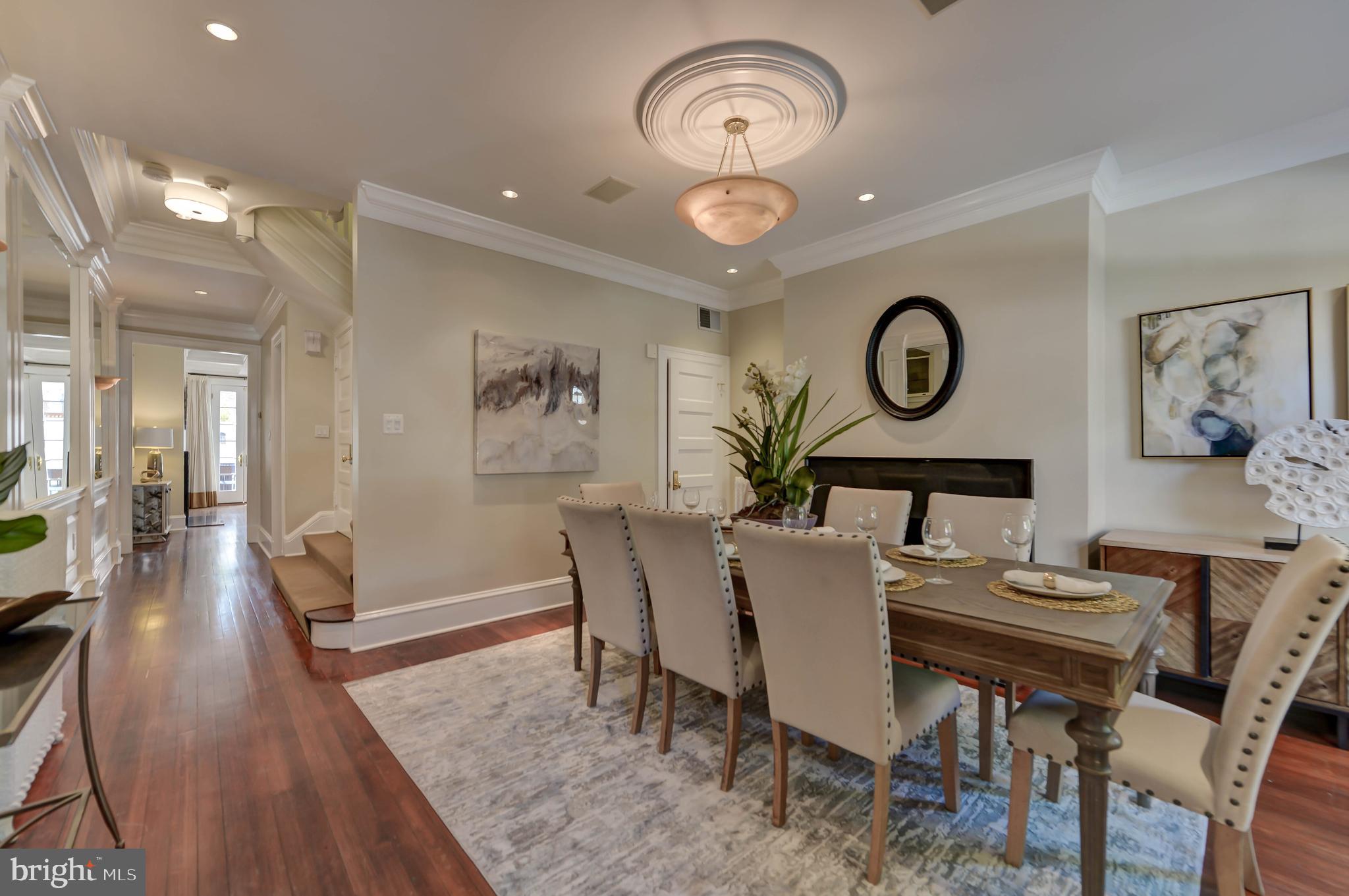 2130 Leroy Place Northwest Washington, DC 20008 - Photo 9 of 98 a view of a dining room with furniture and a chandelier