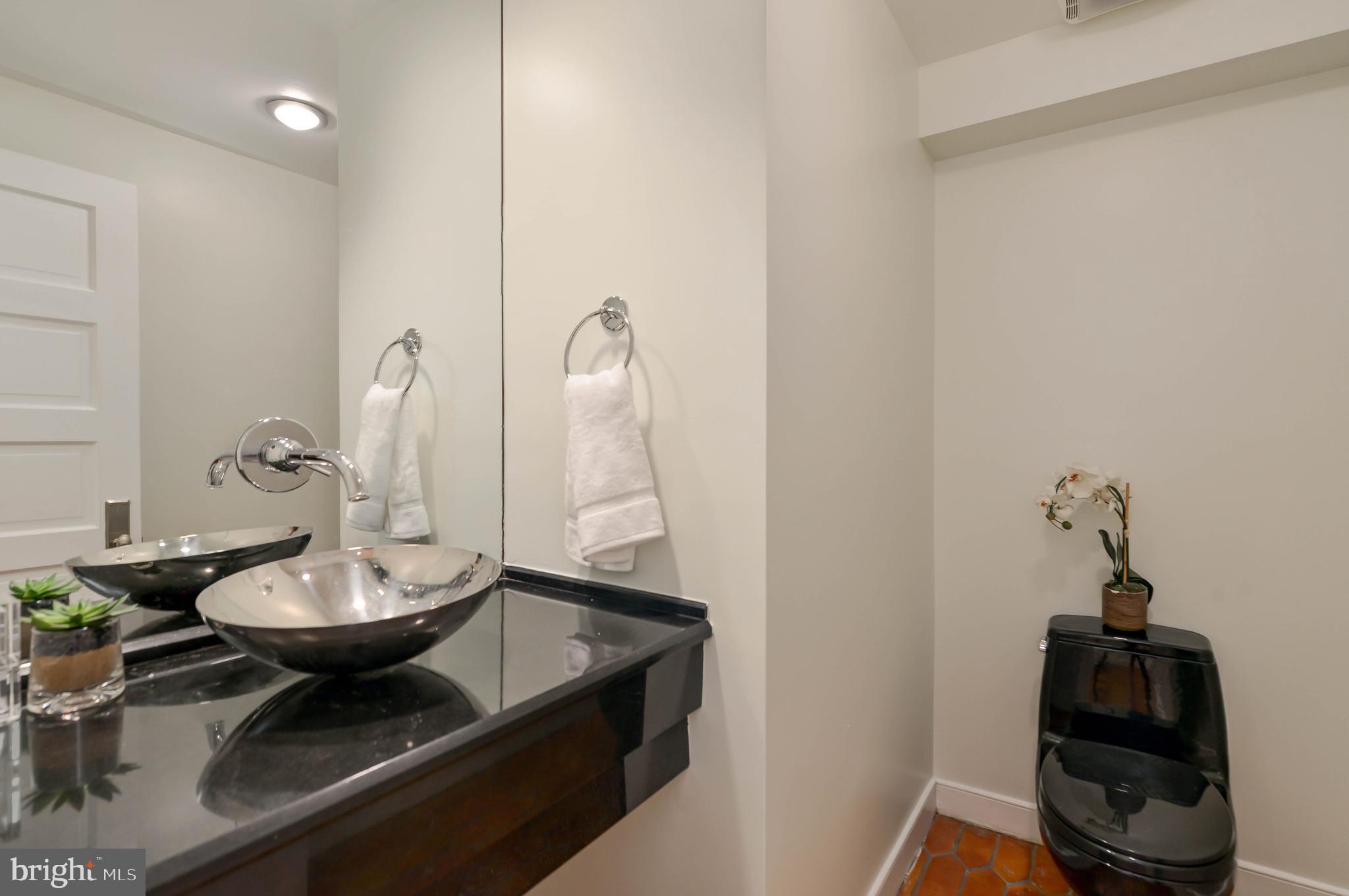 2130 Leroy Place Northwest Washington, DC 20008 - Photo 81 of 98 a bathroom with a sink and a mirror