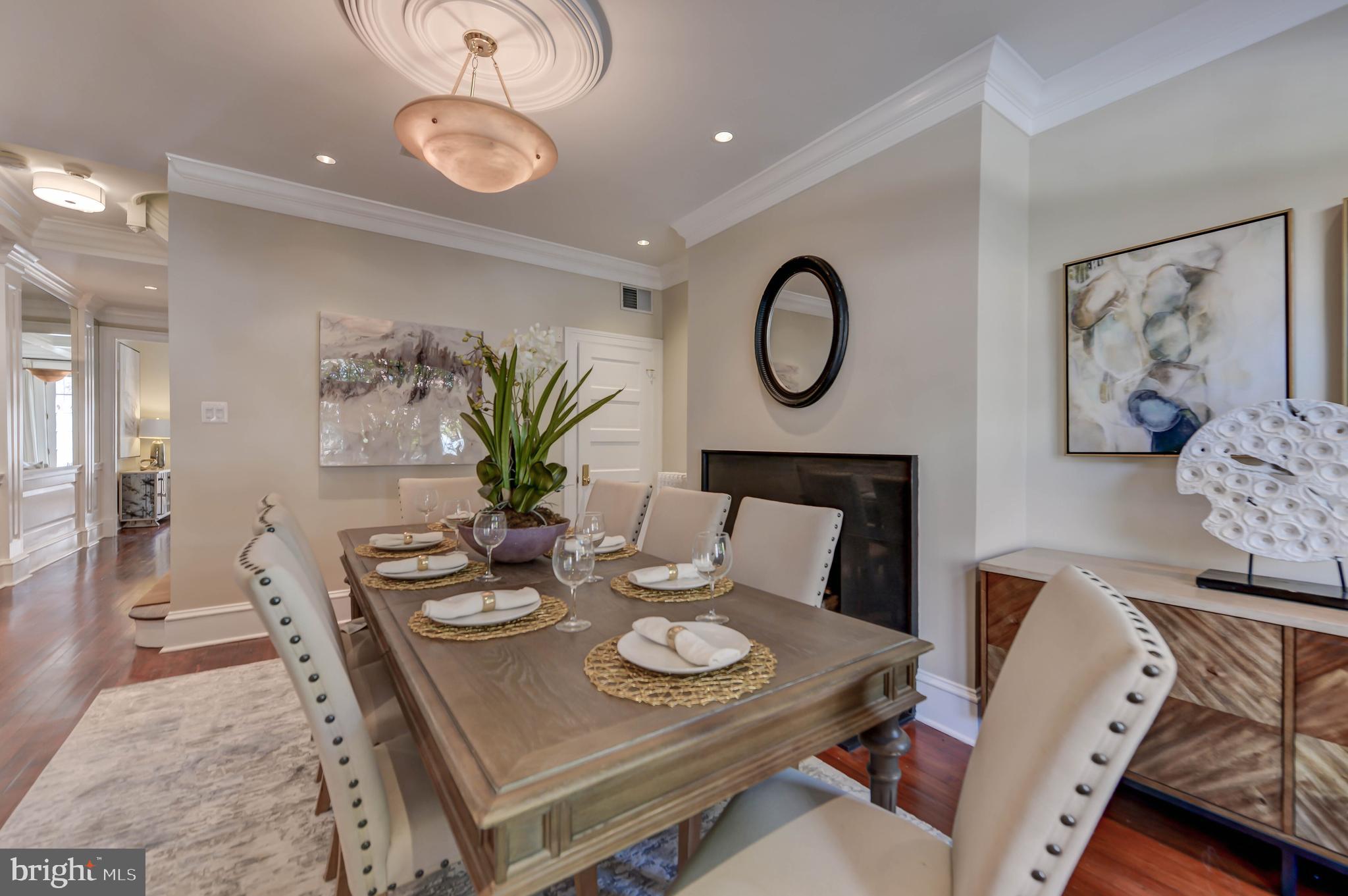 2130 Leroy Place Northwest Washington, DC 20008 - Photo 10 of 98 a view of a dining room with furniture wooden floor and a chandelier