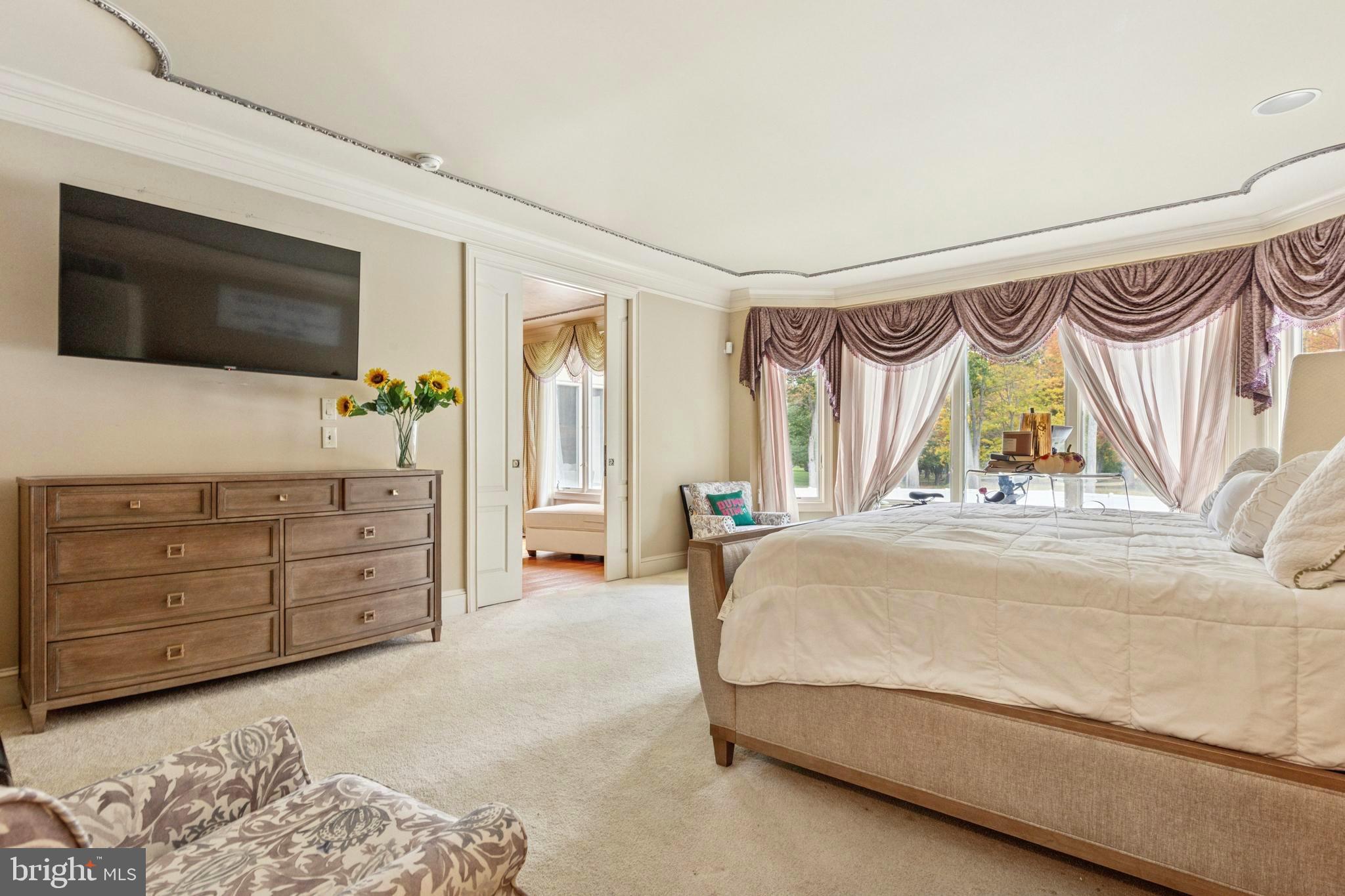 703 Daventry Way Ambler, PA 19002 - Photo 18 of 54 a spacious bedroom with a bed and a television