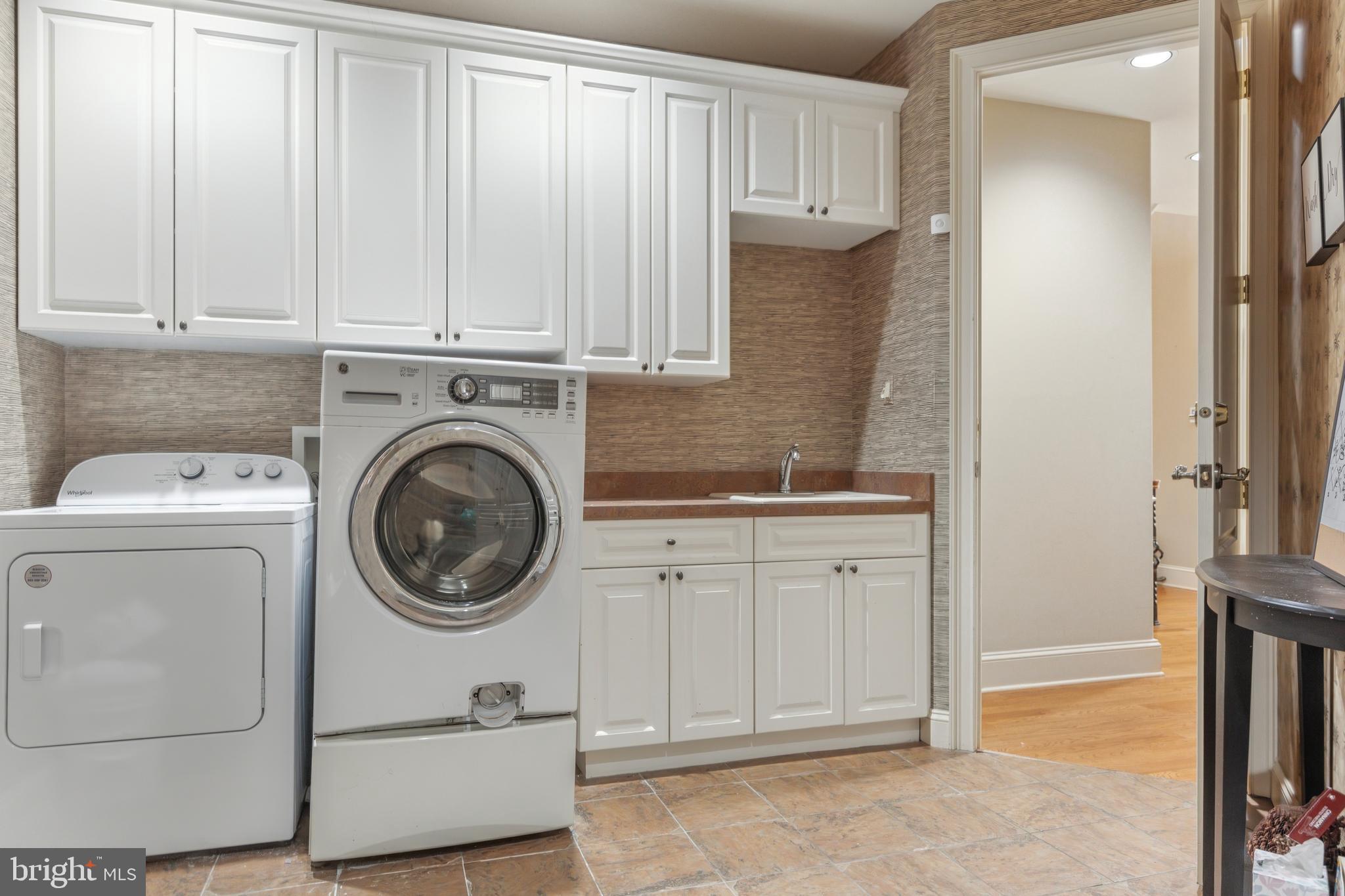 703 Daventry Way Ambler, PA 19002 - Photo 25 of 54 a utility room with sink dryer and washer