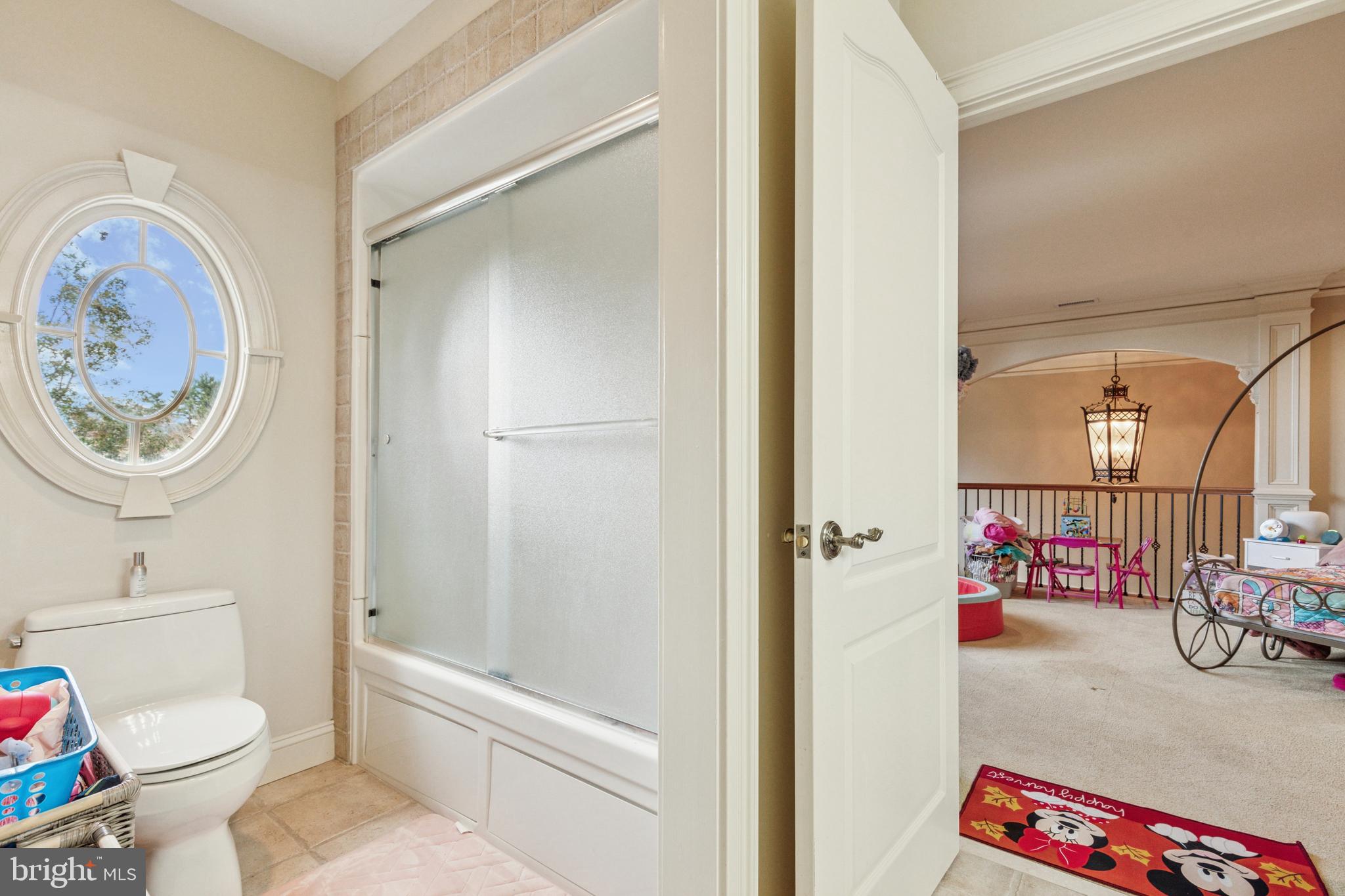 703 Daventry Way Ambler, PA 19002 - Photo 31 of 54 a bathroom with a toilet and a shower curtain