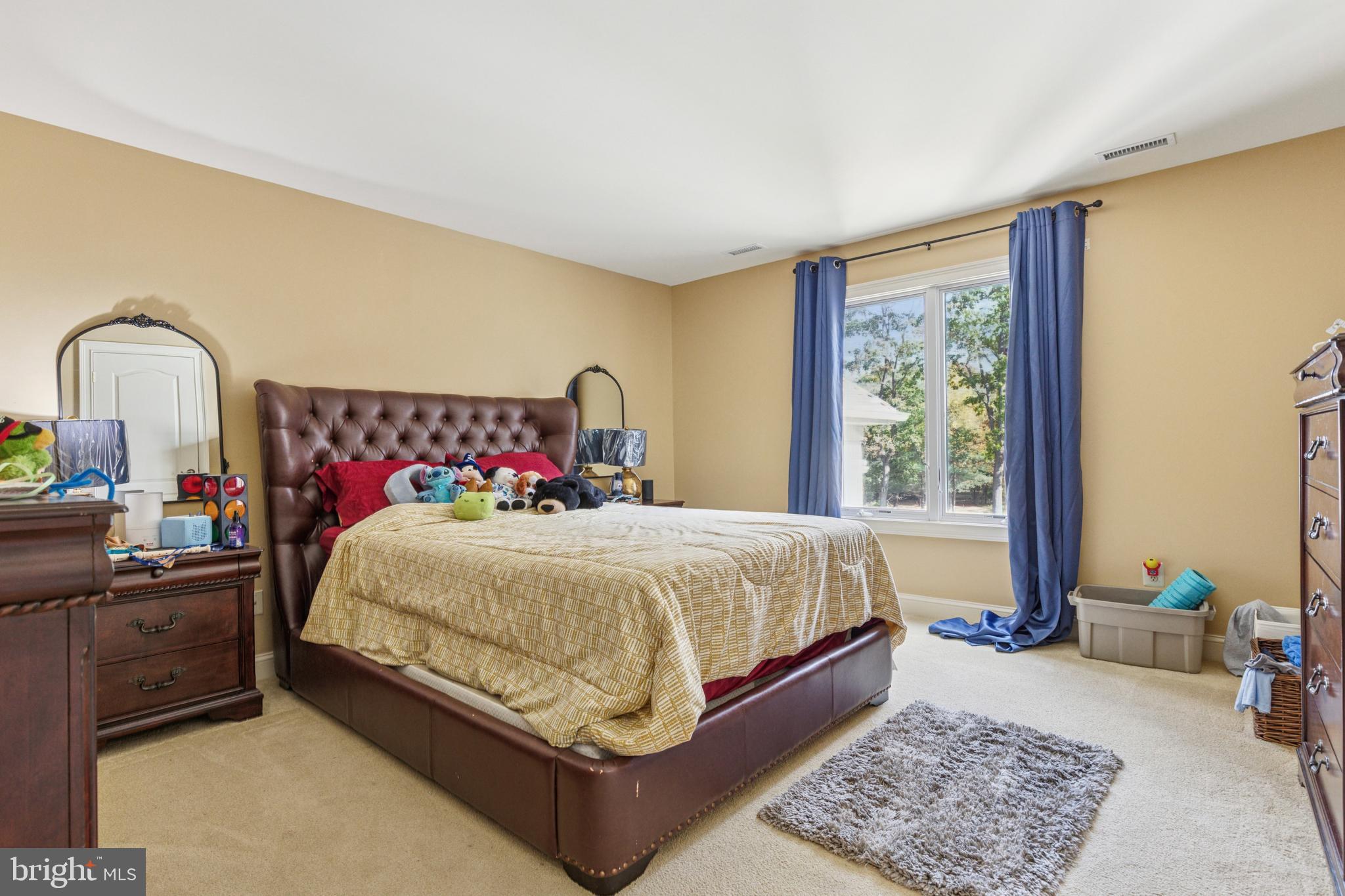 703 Daventry Way Ambler, PA 19002 - Photo 34 of 54 a spacious bedroom with a bed and a window