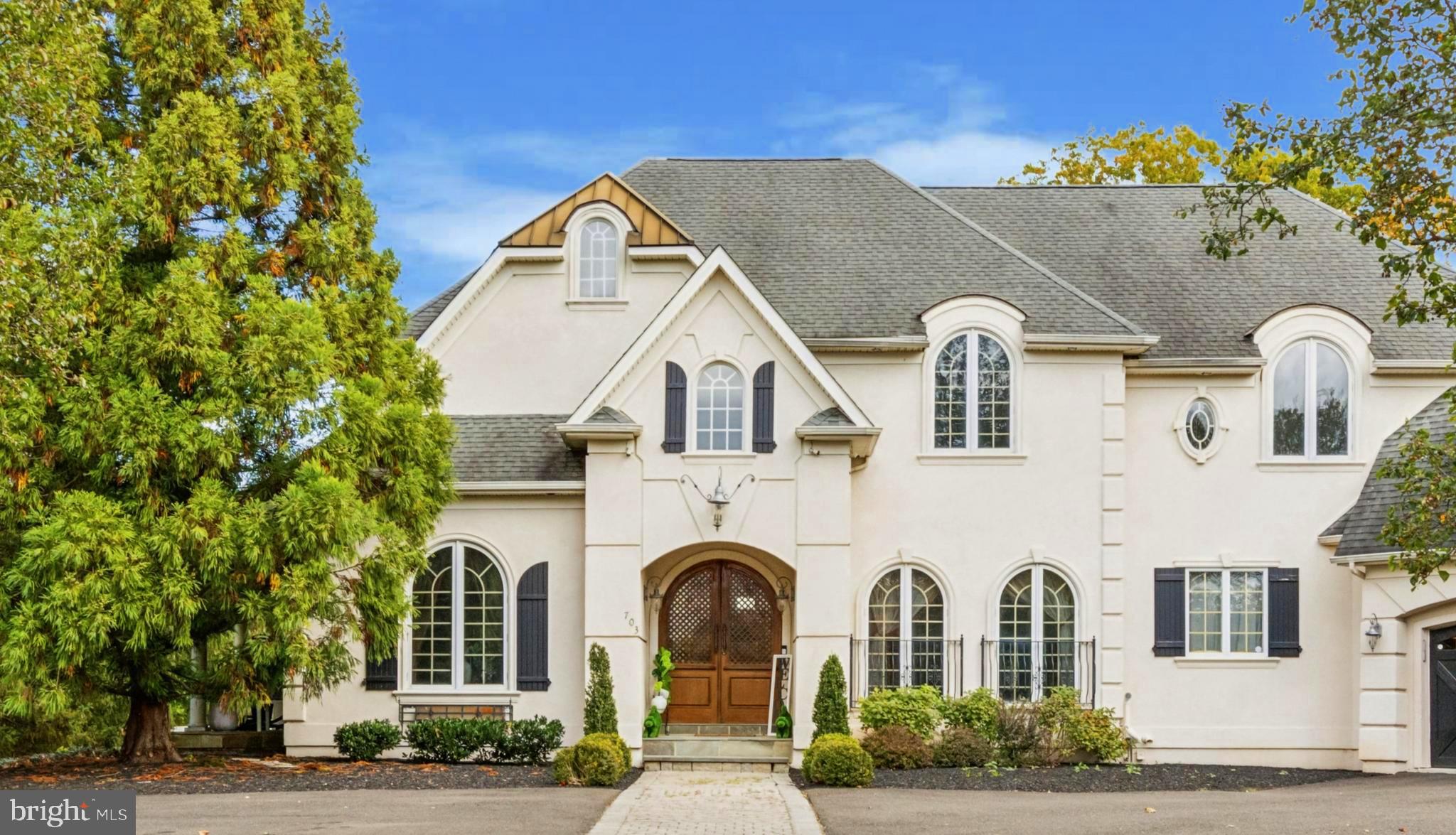 703 Daventry Way Ambler, PA 19002 - Photo 4 of 54 a front view of a house with a garden