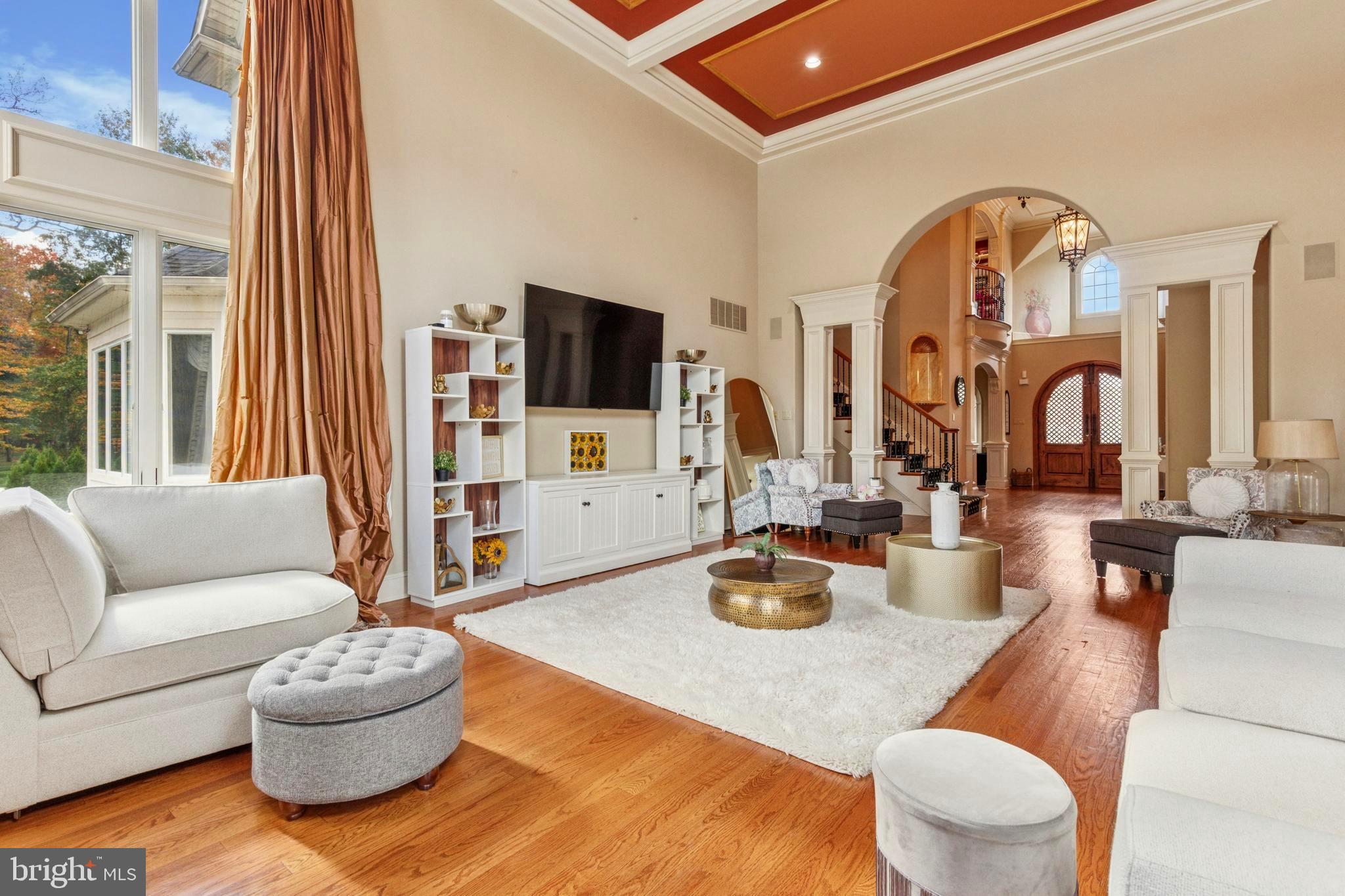 703 Daventry Way Ambler, PA 19002 - Photo 7 of 54 a living room with furniture a flat screen tv and a large window
