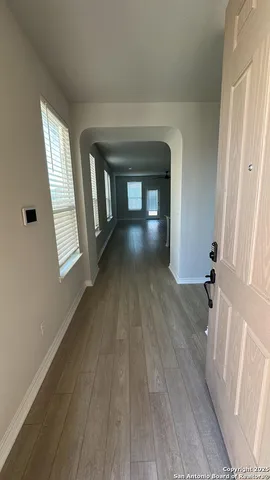 a view of gallery with wooden floor