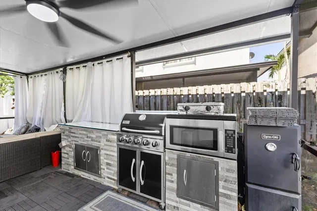 a kitchen with a stove and a microwave