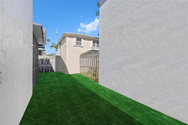 a view of a back yard of the house