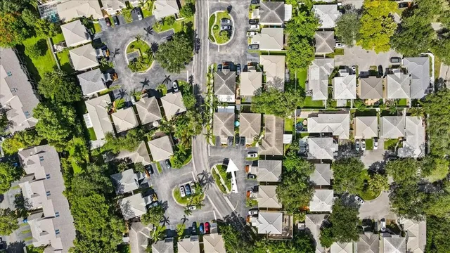 a view of parked cars in front of house
