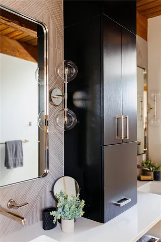 a bathroom with a double vanity sink mirror and shower