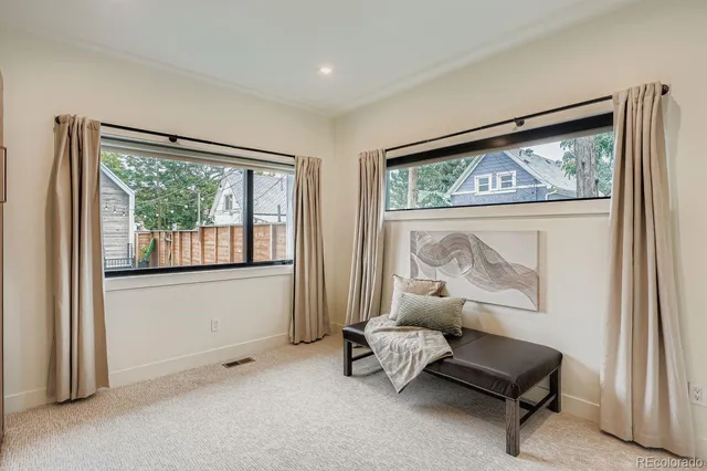 a bathroom with a sink a toilet a mirror and shower
