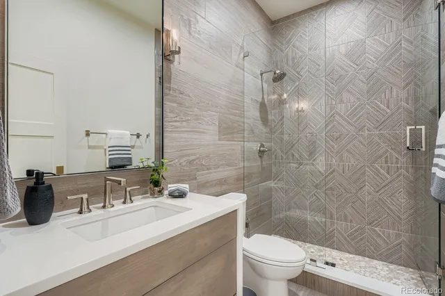 a view of an empty room and wooden floor