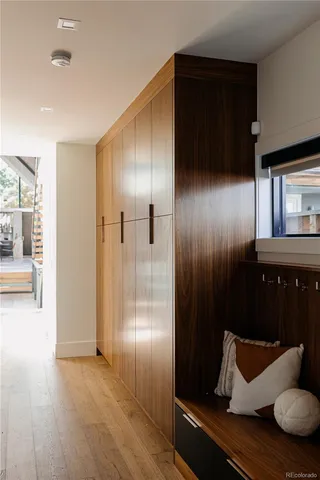 a view of a deck with couches and wooden fence