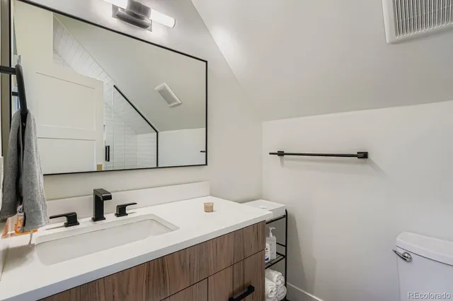 a view of front door with a garden