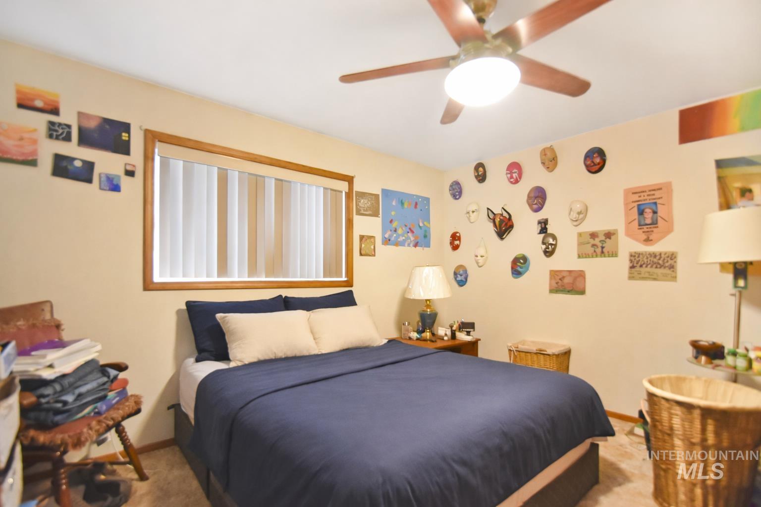 3727 17th Street Lewiston, ID 83501 - Photo 6 of 10 Bedroom featuring a ceiling fan and carpet