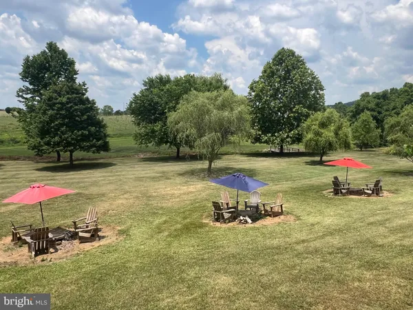 an outdoor space with furniture and umbrella
