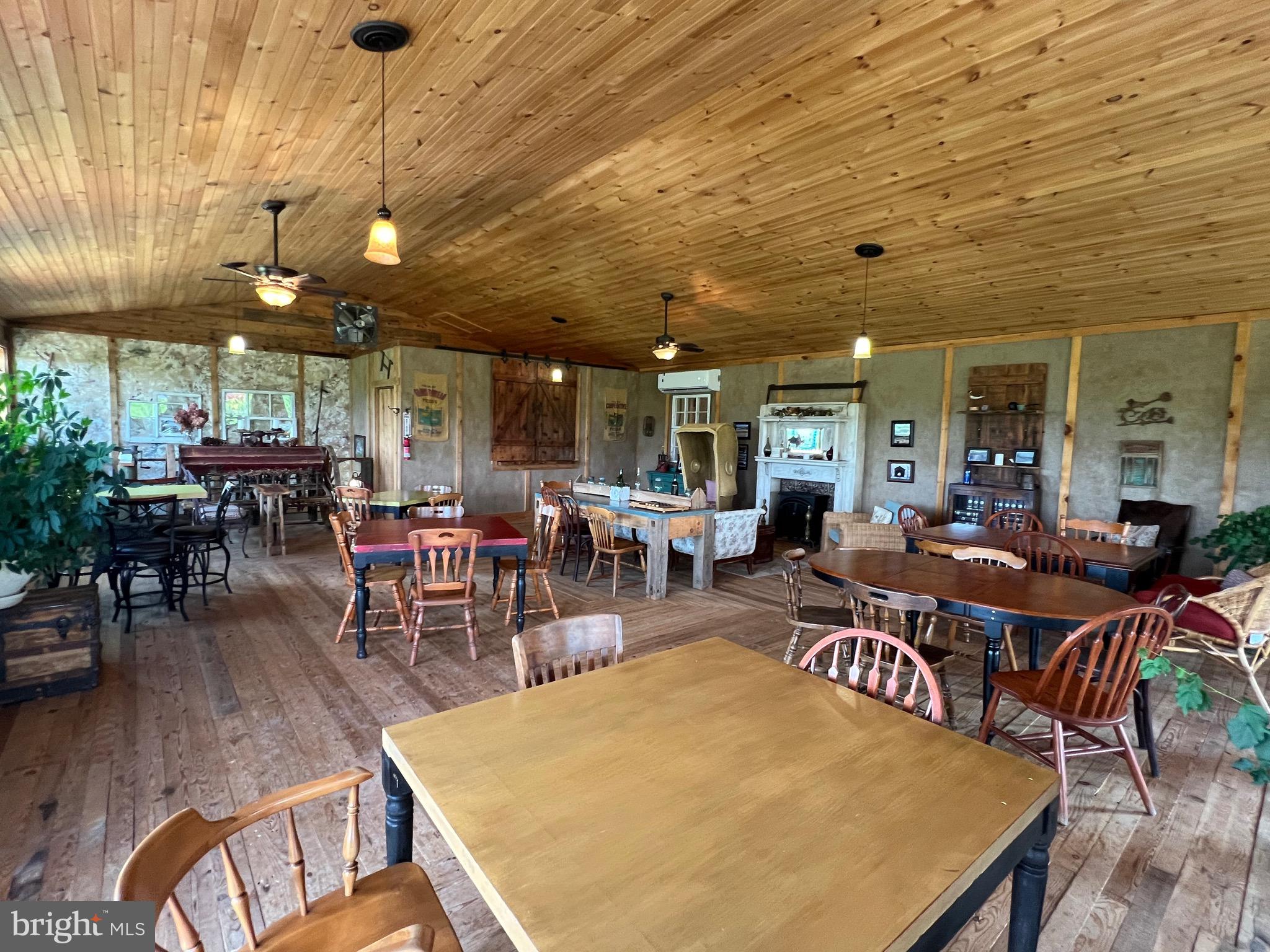 2110 Quicksburg Road Quicksburg, VA 22847 - Photo 39 of 54 a outdoor dining space with furniture wooden floor and plants