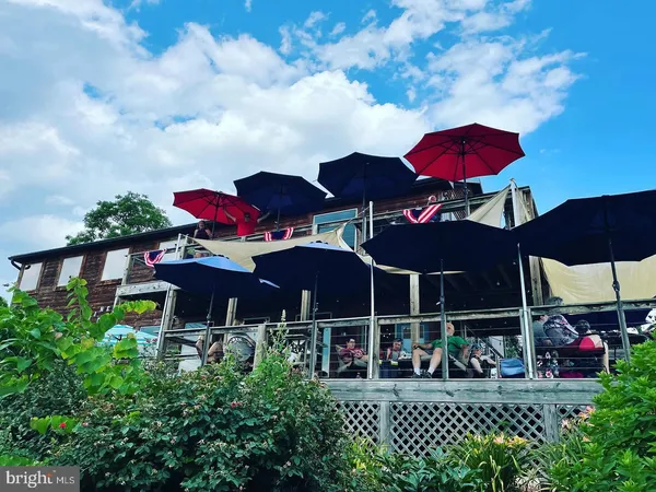 a view of house with an outdoor seating