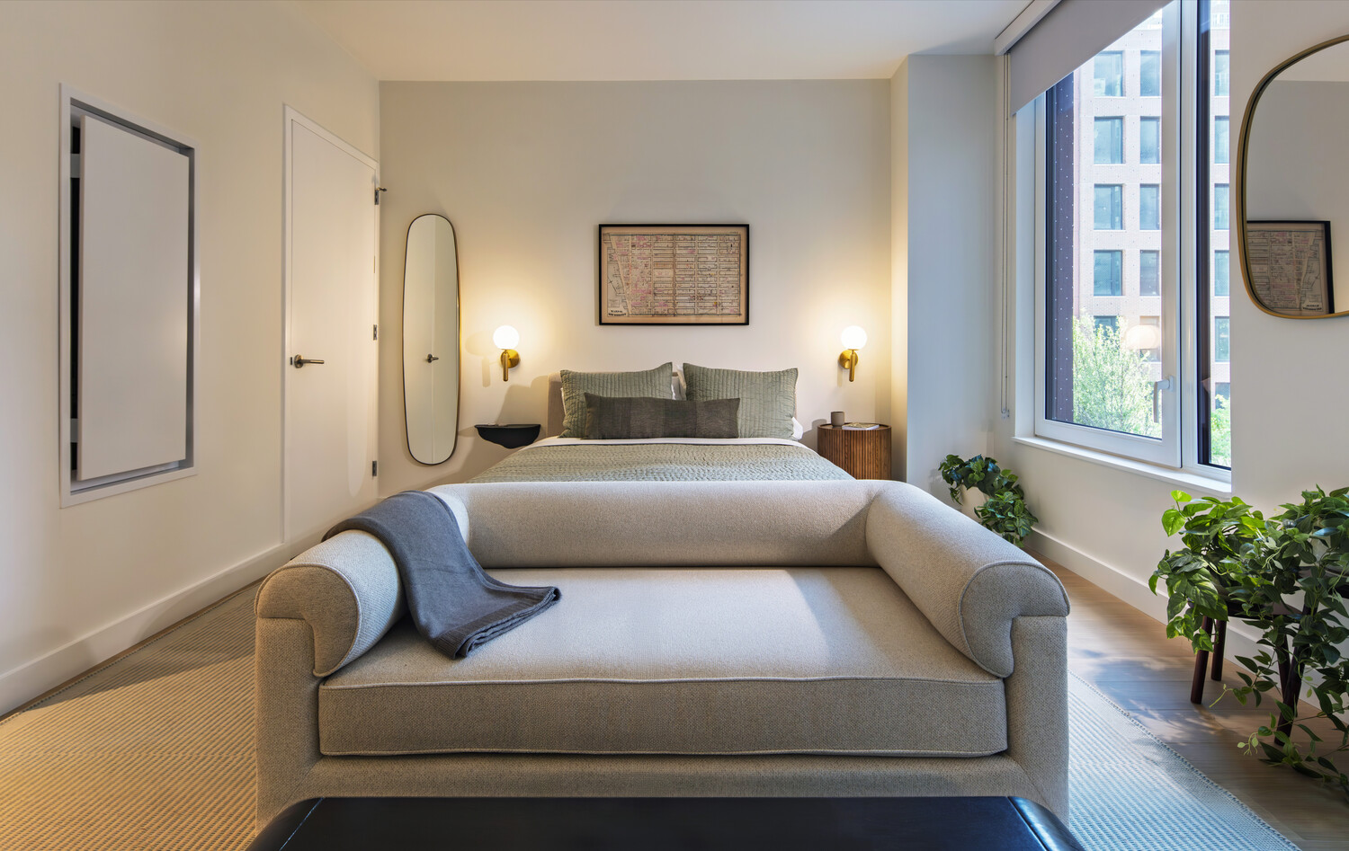 335 8th Avenue, Unit 226 Manhattan, NY 10001 - Photo 2 of 10 a bedroom with furniture and a large window