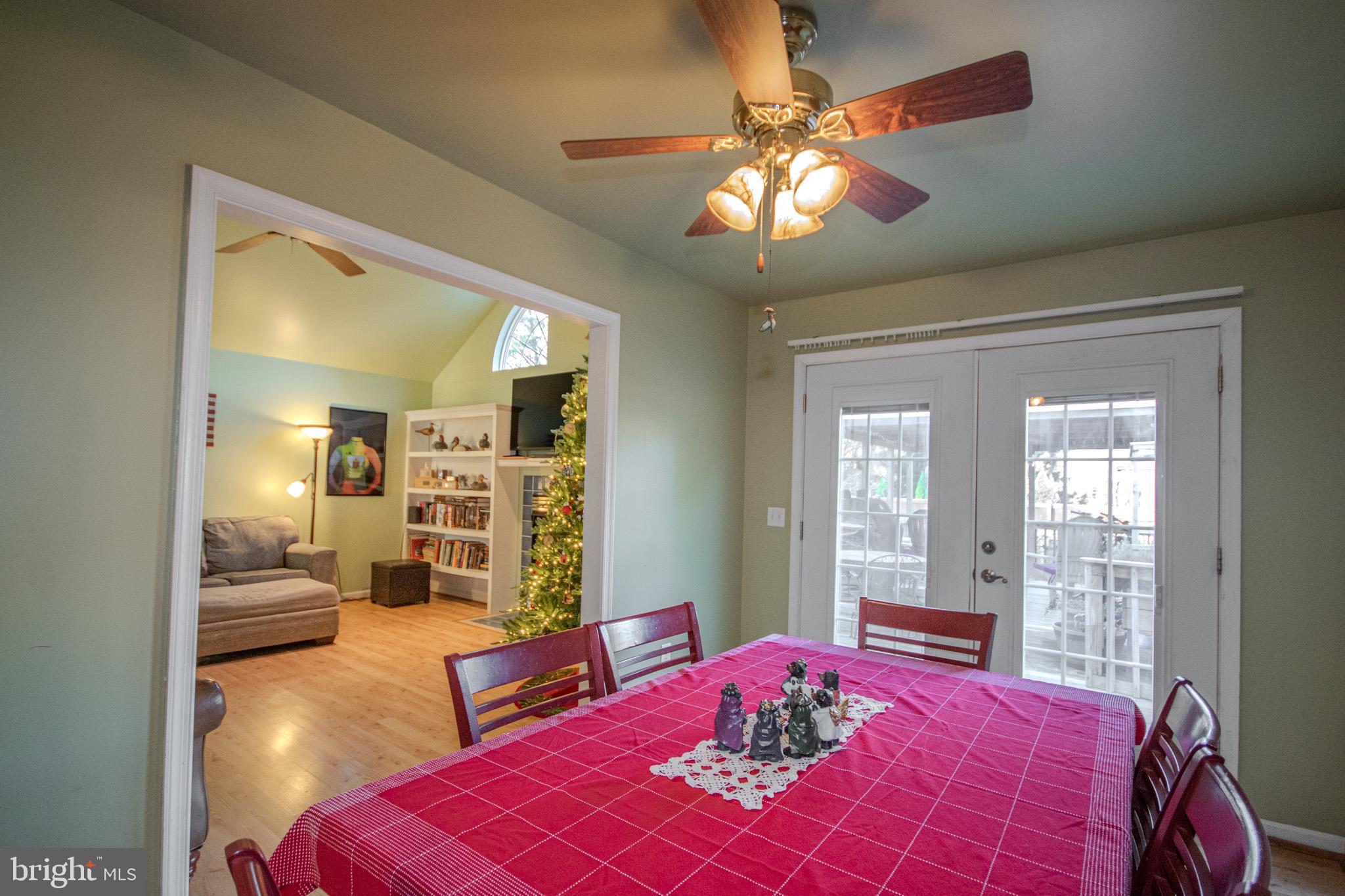 5520 Cedarcrest Road Salisbury, MD 21801 - Photo 13 of 41 a bedroom with a large bed and a chandelier