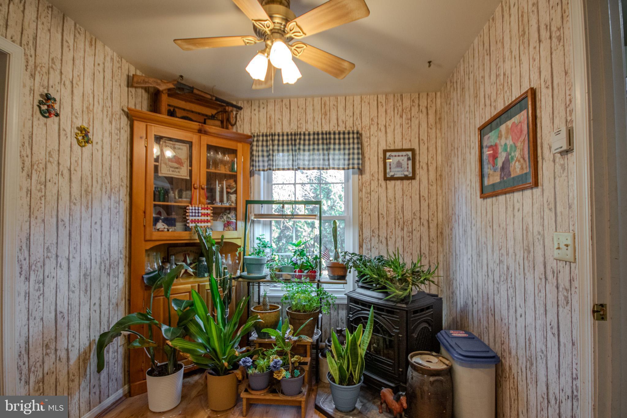 5520 Cedarcrest Road Salisbury, MD 21801 - Photo 16 of 41 a dining room filled with furniture and a potted plant