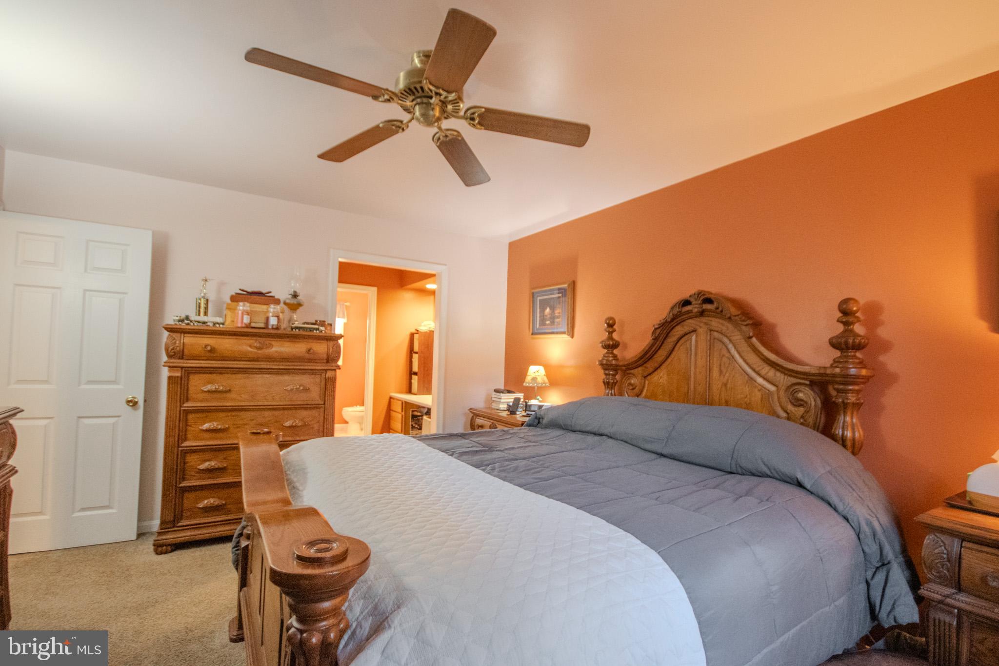 5520 Cedarcrest Road Salisbury, MD 21801 - Photo 19 of 41 a bedroom with a bed and chair