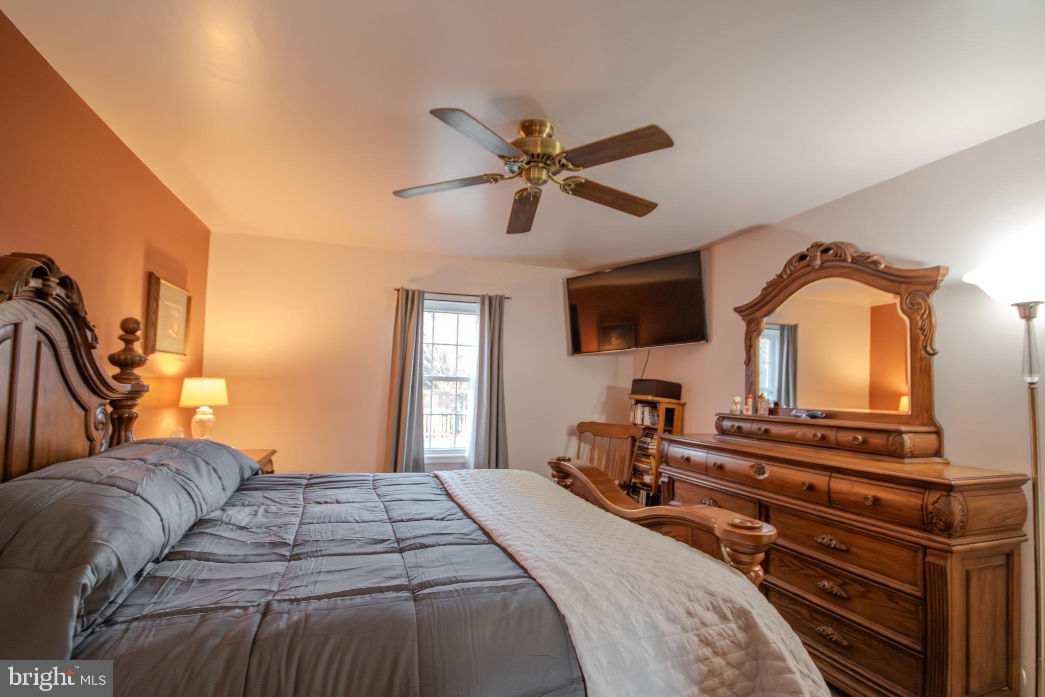 5520 Cedarcrest Road Salisbury, MD 21801 - Photo 20 of 41 a bedroom with a bed and a flat screen tv